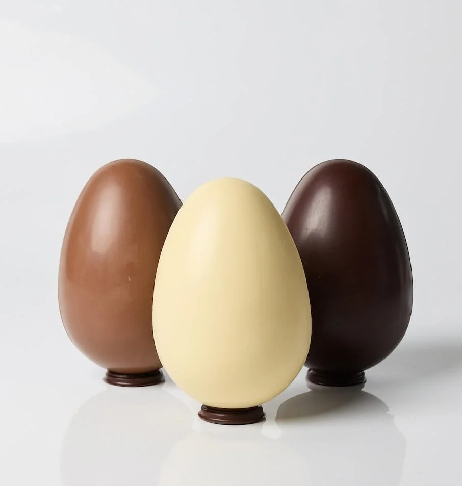 artisan chocolate easter eggs in white chocolate, milk chocolate and dark chocolate, with a surprise inside