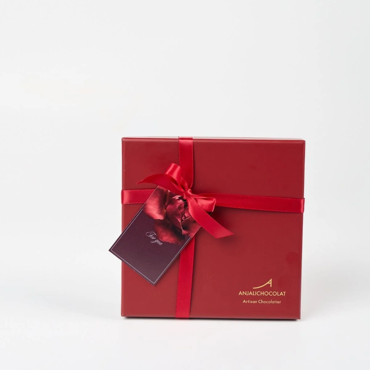 Luxurious red gift box of 16 handmade chocolate hearts. The perfect valentine's day gift