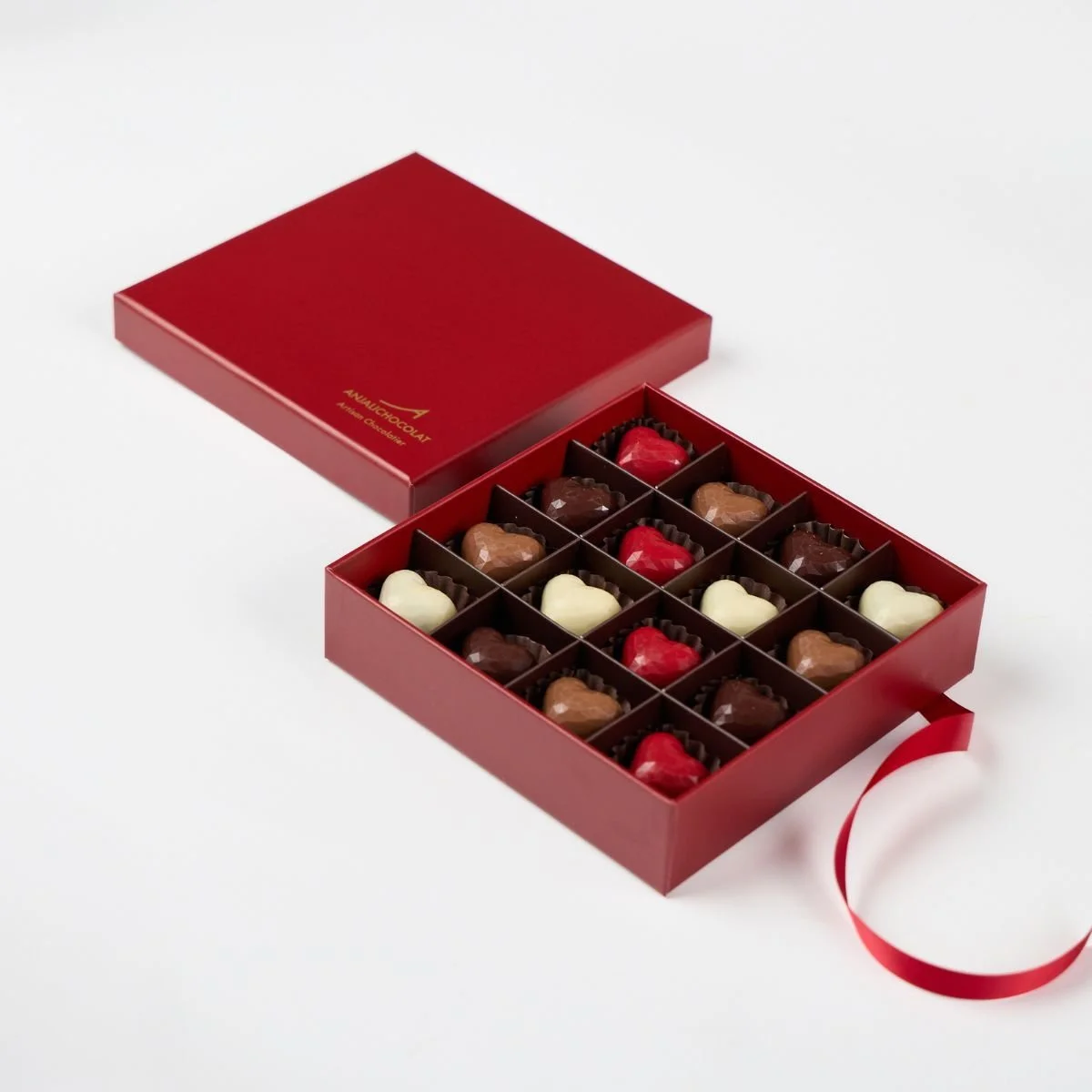 Luxurious red gift box of 16 handmade chocolate hearts. The perfect valentine's day gift
