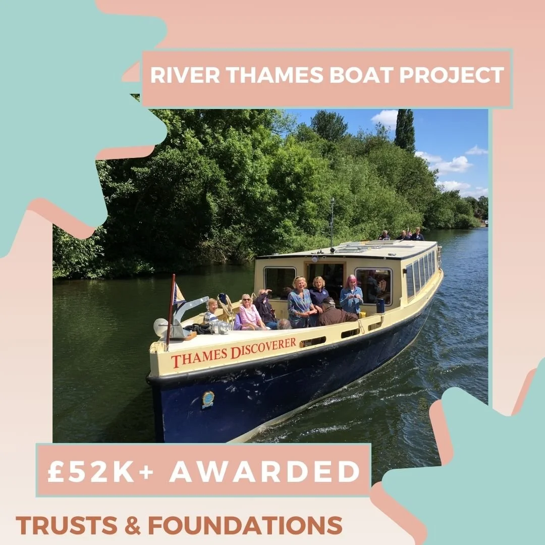 Thames Discoverer boat sailing along the Thames on a sunny day. Blue and pink graphics, text reads: River Thames Boat Project, £52k awarded, Trusts & Foundations.