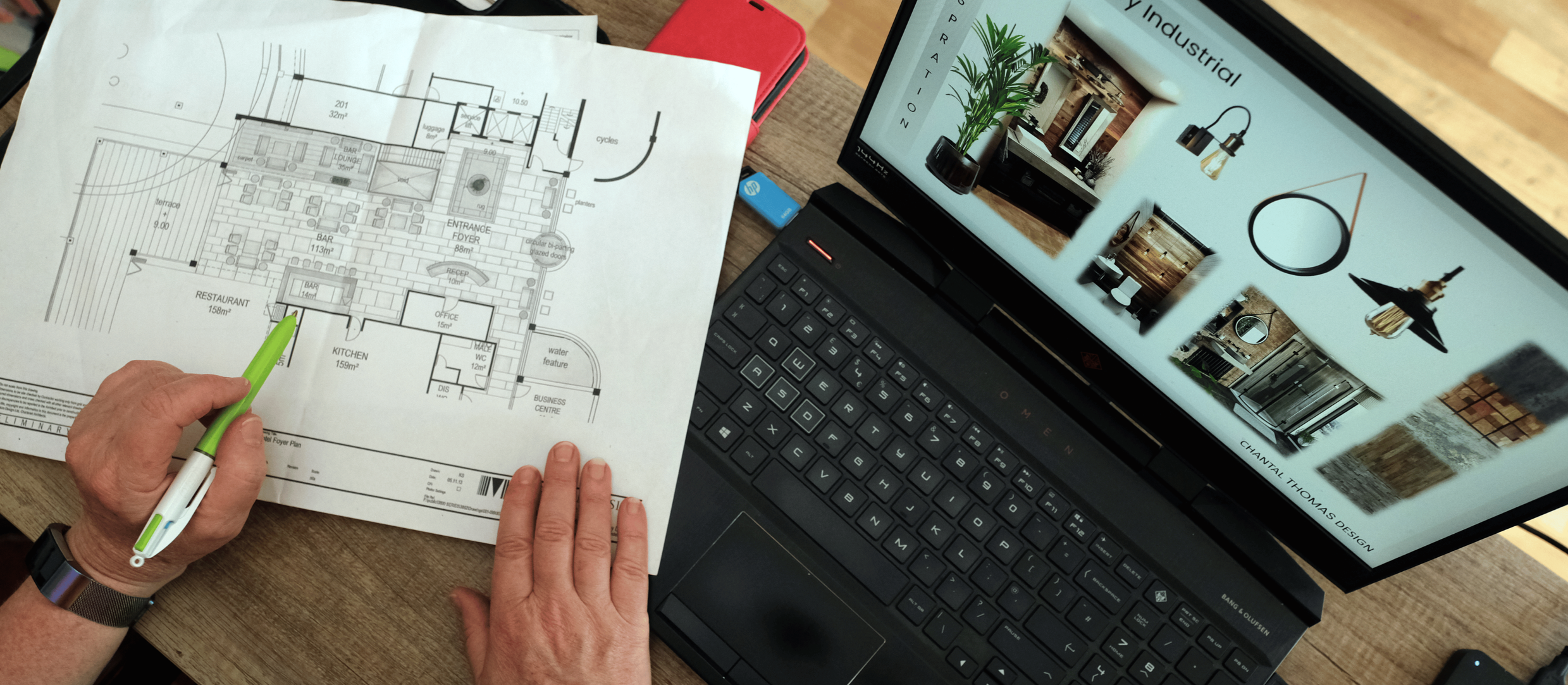 Chantal Thomas reviewing an interior design floor plan and concept board