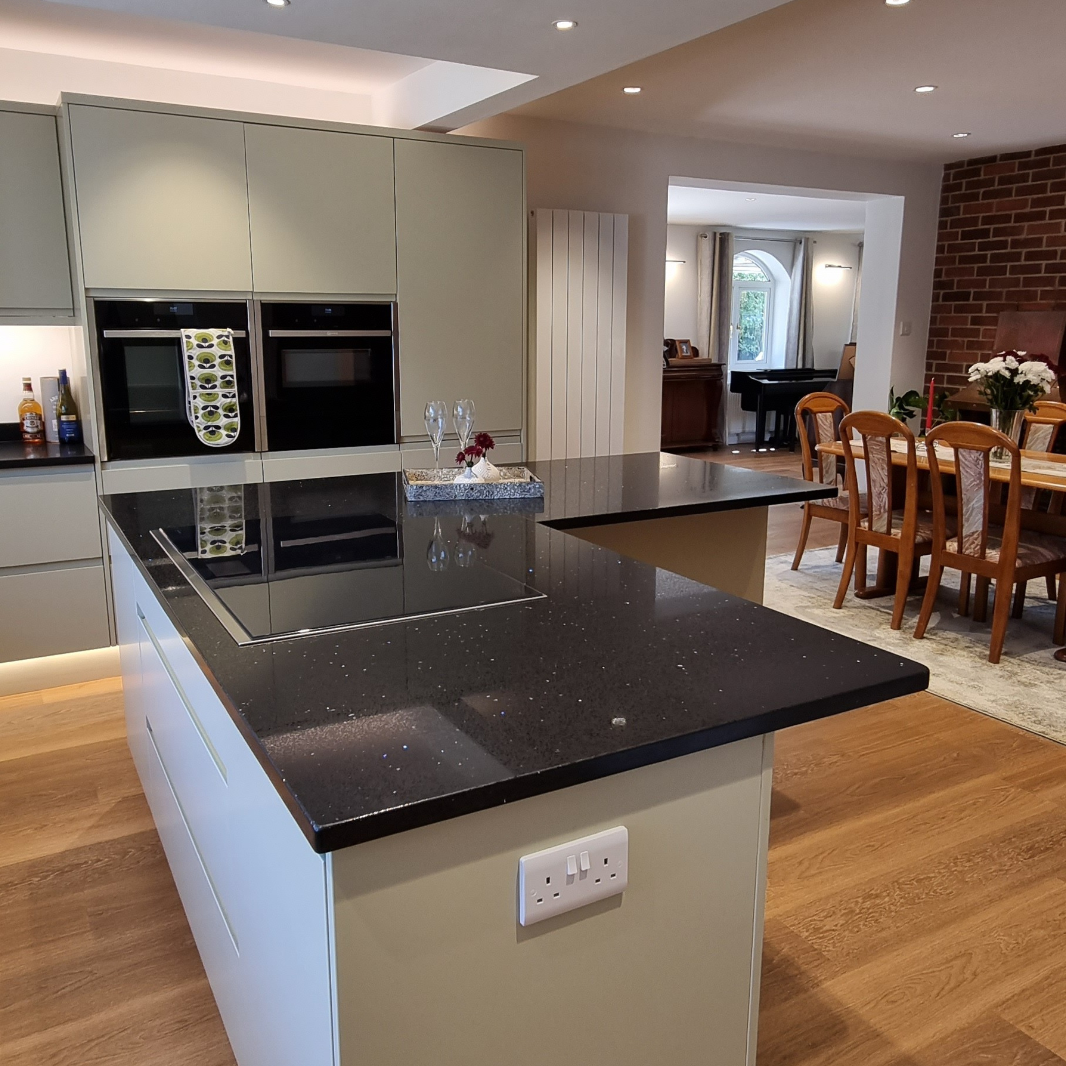 Open-plan kitchen layout showing the route from the kitchen into the dining area.