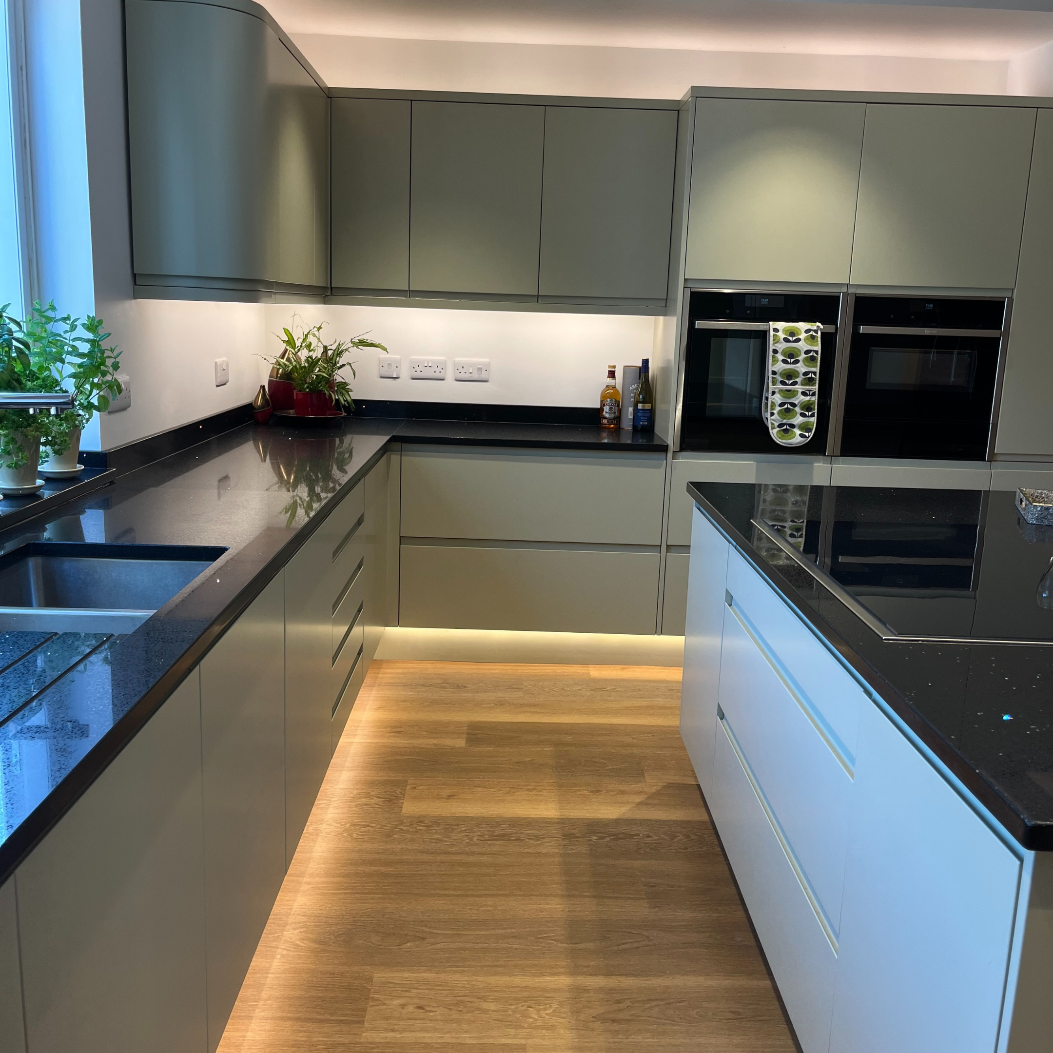 Kitchen working area with island, sink, storage and clear circulation space