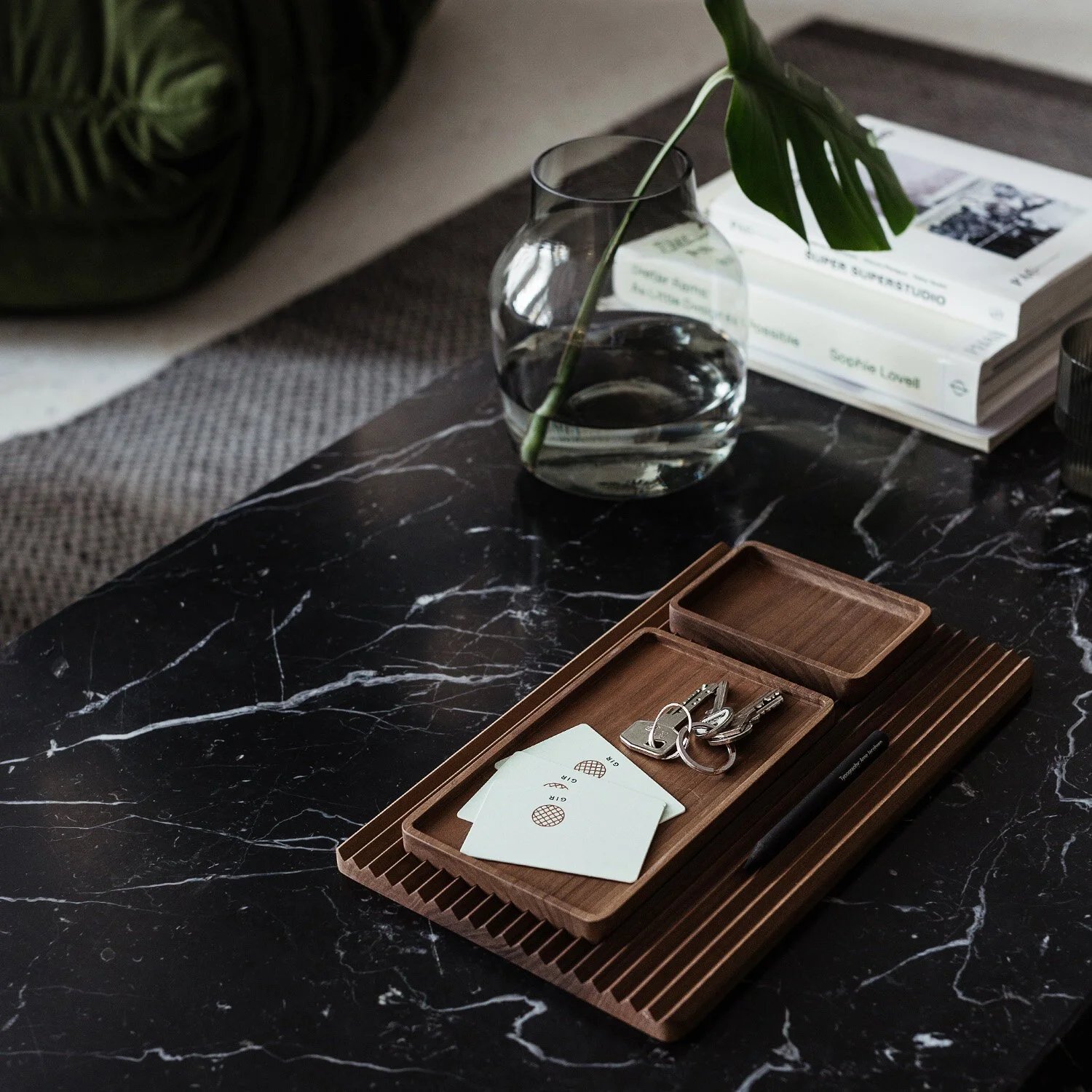 Natural wood home accessories showing the varying heights and rhythmic proportions of the collection.