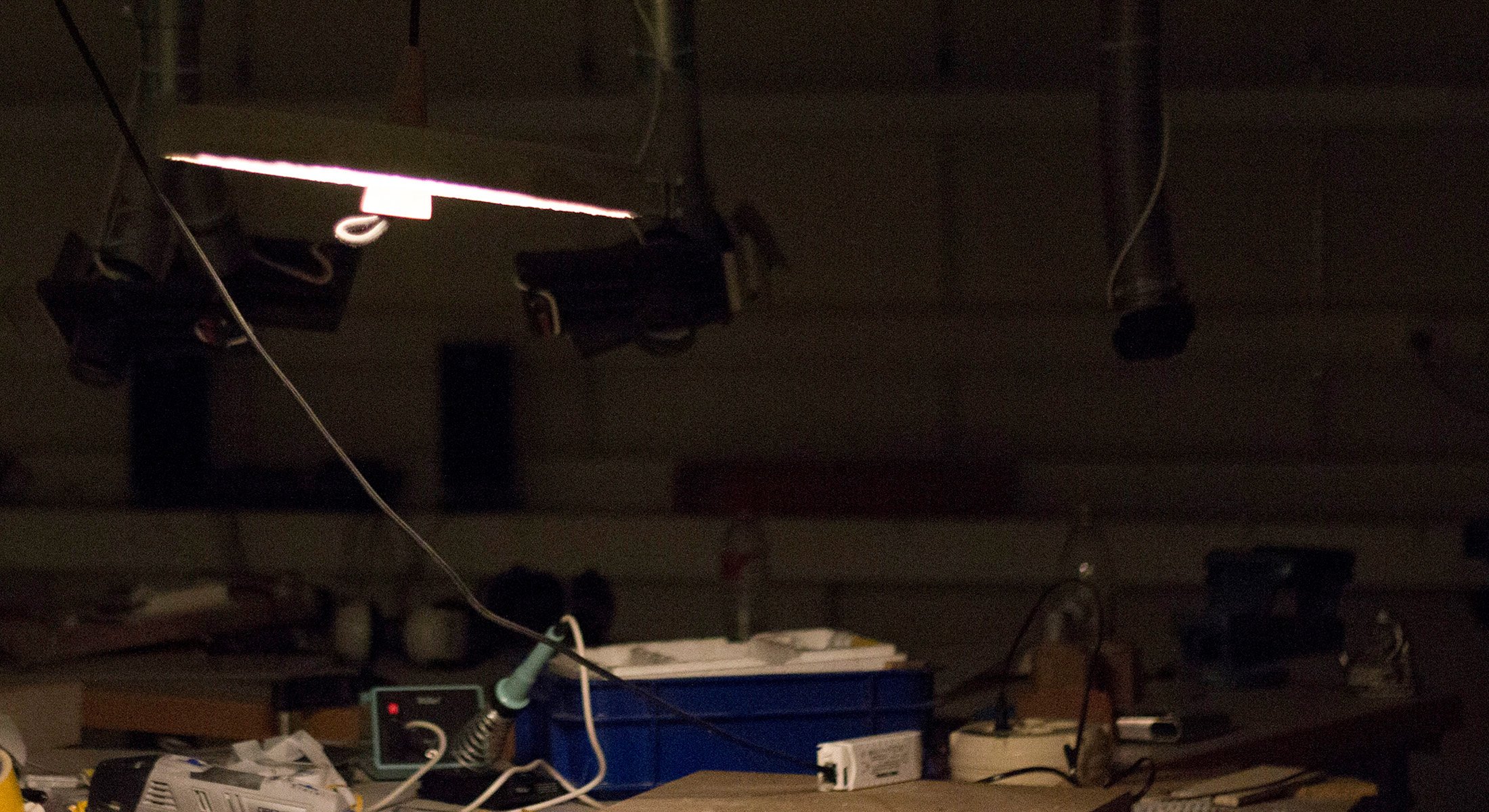 Origen experimental lamp designed by Carlos Jimenez, featuring a minimalist dialogue between a concrete shade and a wooden cone.