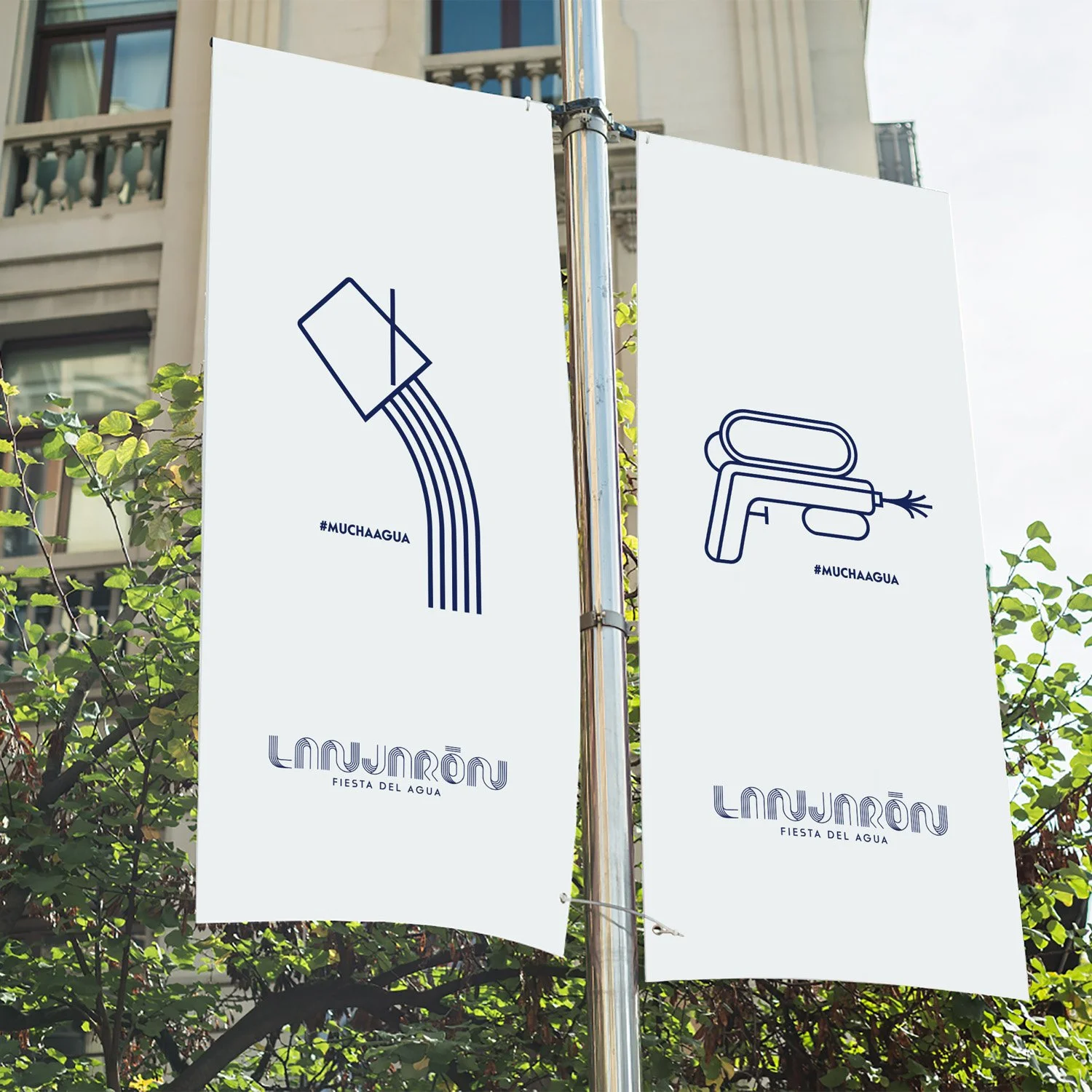 Real world application of the Fiesta del Agua branding on street banners and festival signage.