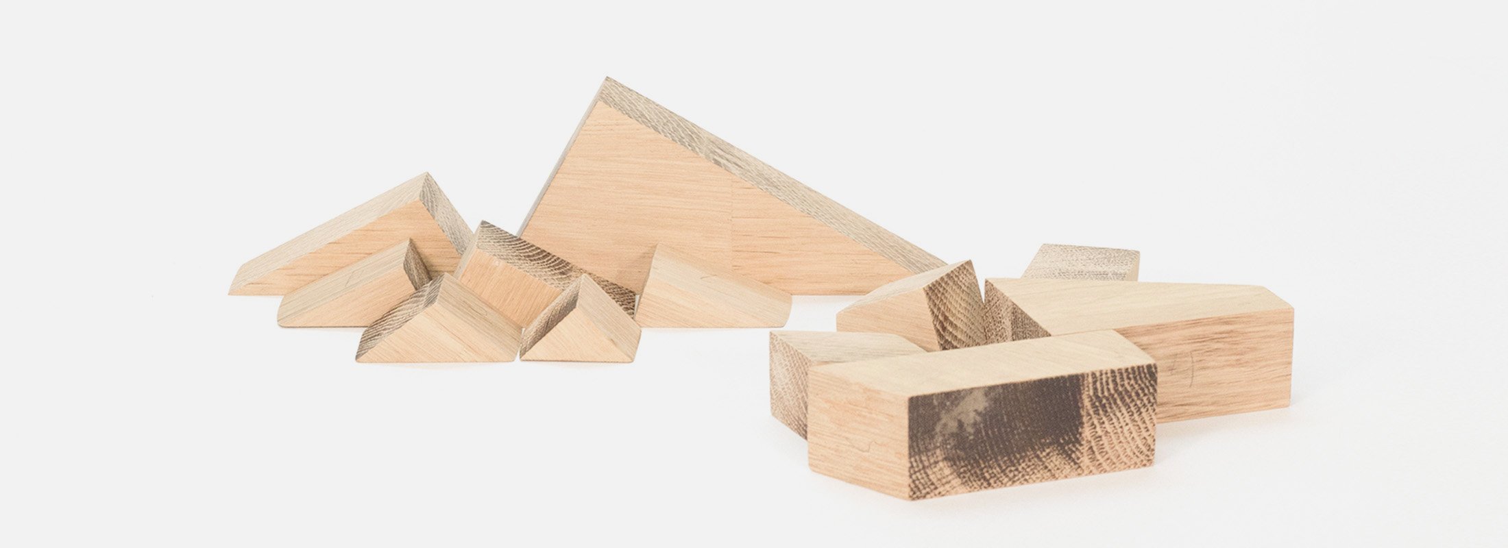 A set of geometric wood pieces by Carlos Jiménez called Horizons, simulating a mountain landscape.