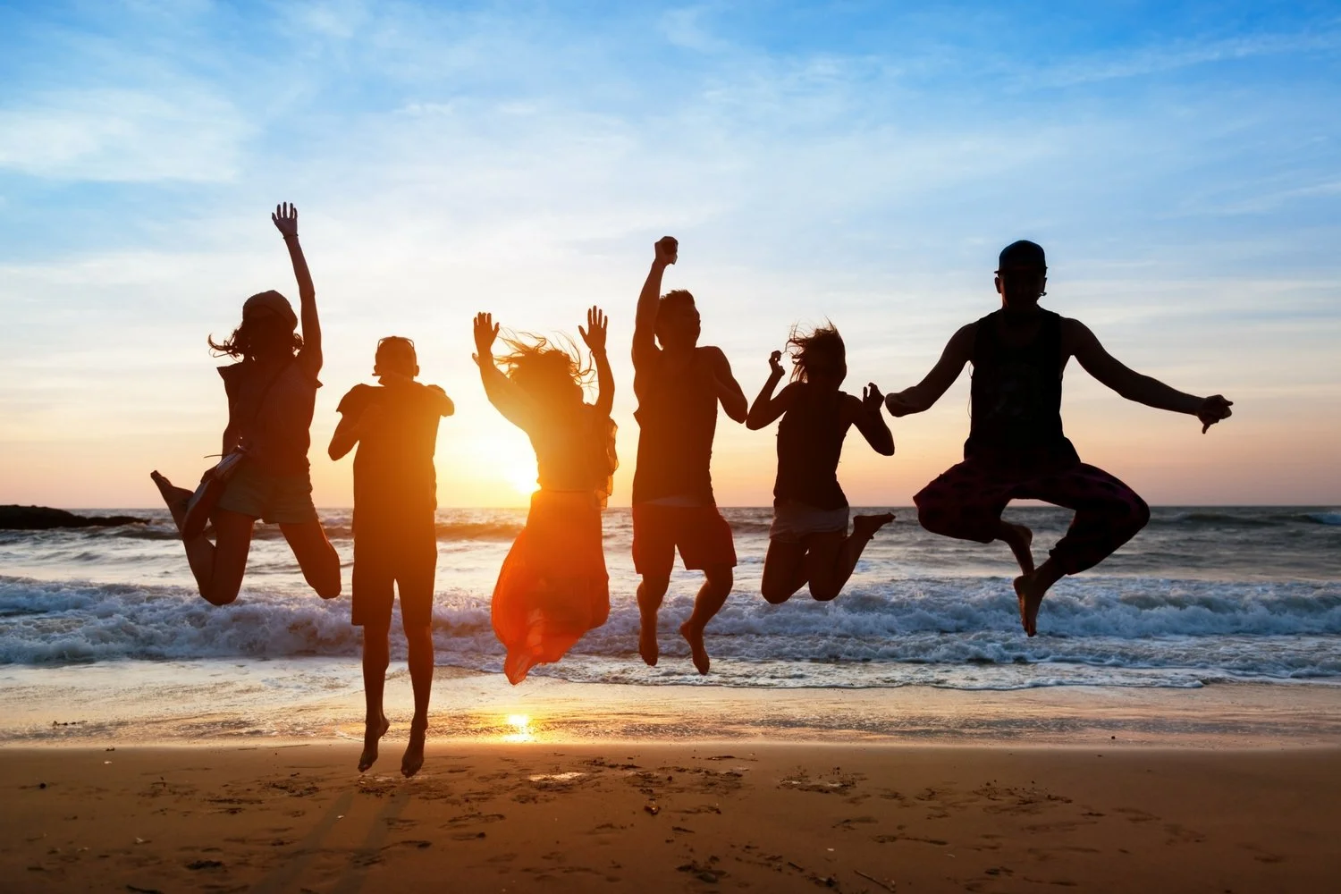 image_groupjump_beach.jpeg