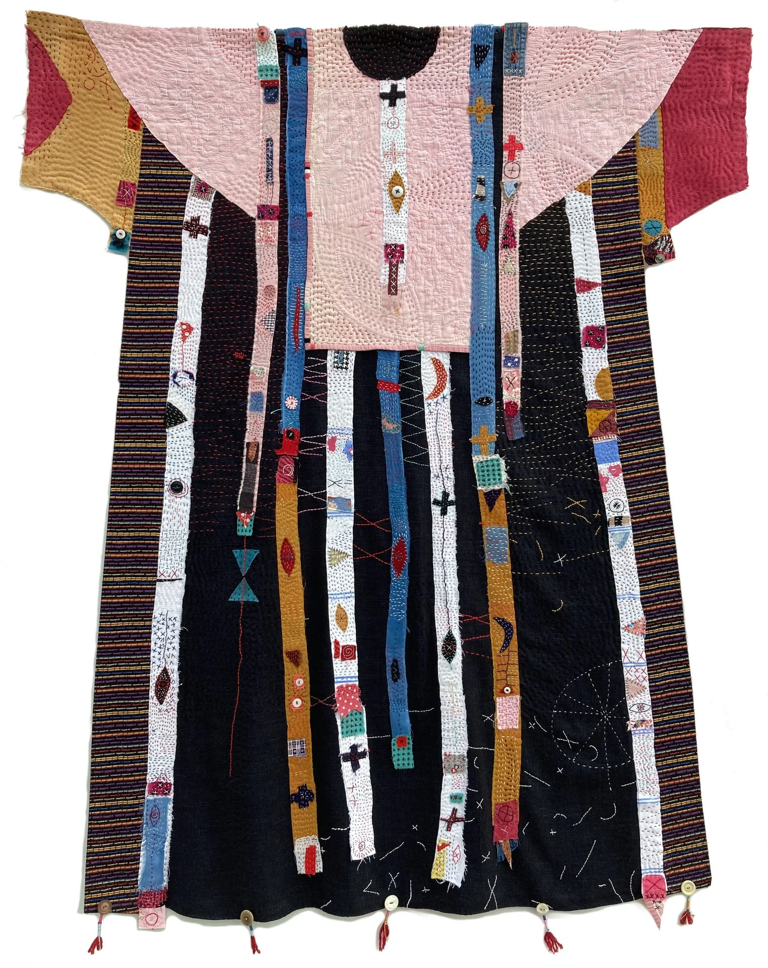 Helen Geglio, "Apron Strings: Milestones and Between," cotton, linen, found quilt, and buttons, 55 x 43 inches.