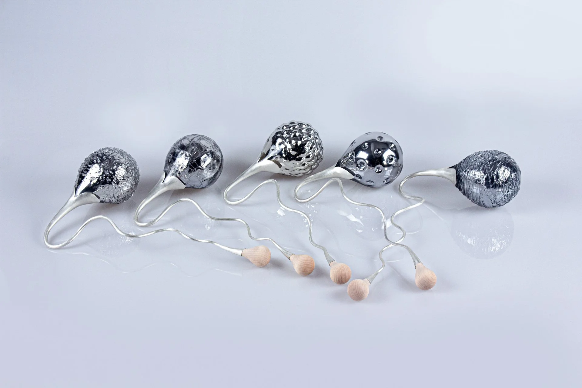 Isabel Zeng, "Watchers," mirrored blown glass, sterling silver, hard maple, paired with performance video, 14 x 9 x 5 inches.