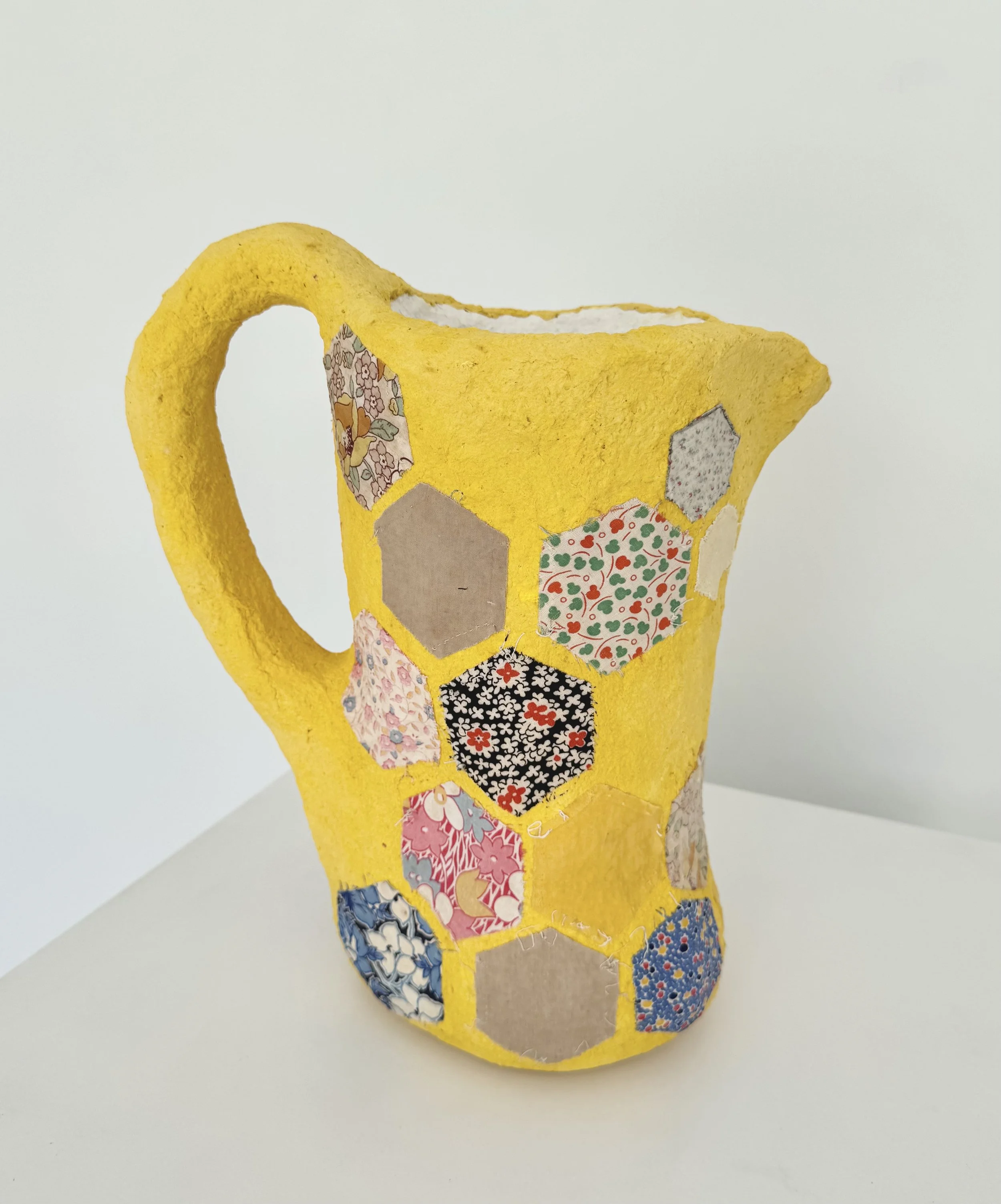 Dana Caldera, "Lemonade After School," found fabric, paperclay, pigment, found vessel, aluminum foil, plaster bandage.
