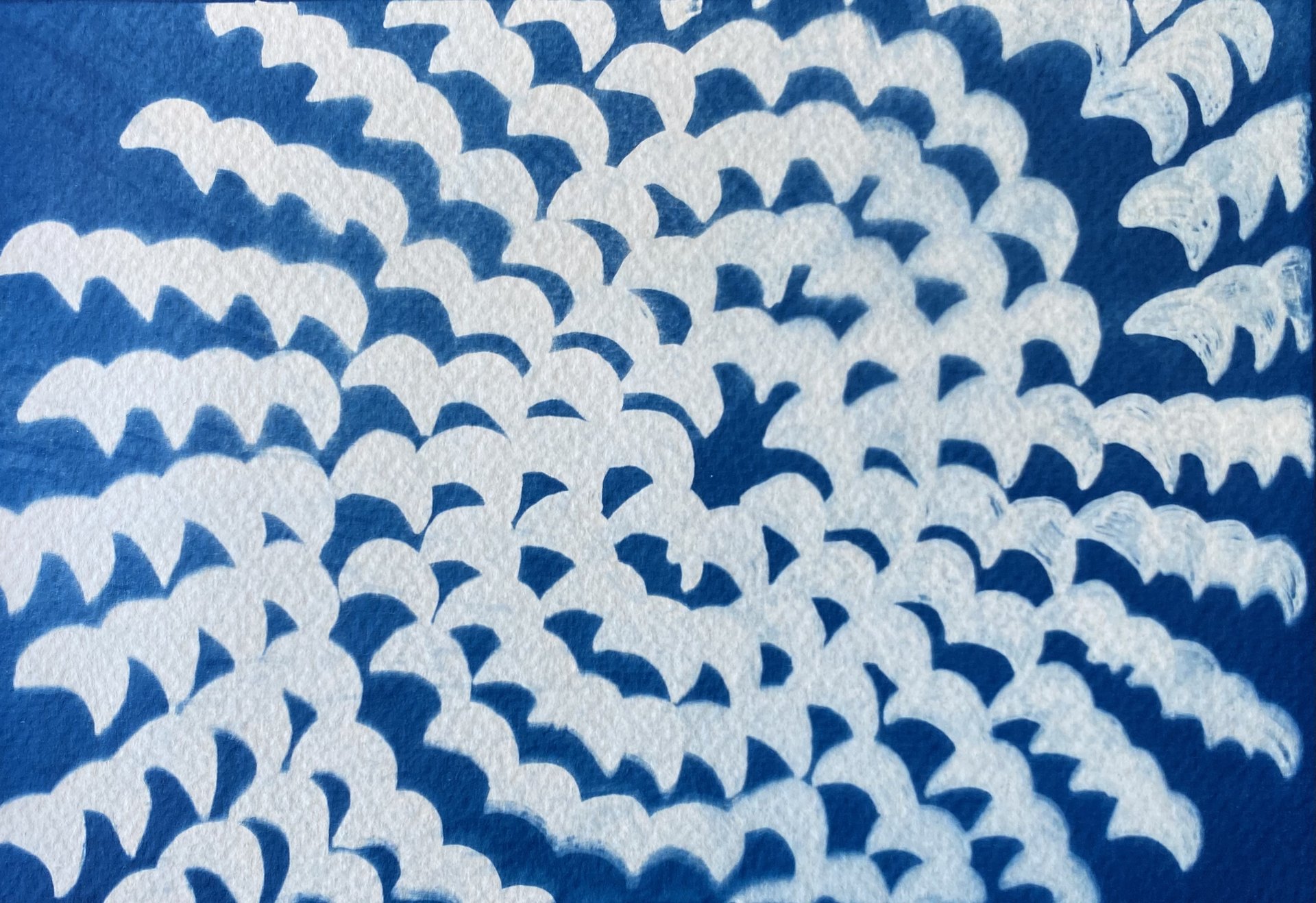 Madelynn Dickerson, "Partial Eclipse Through a Colander," cyanotype on watercolor paper, 5.5 x 8 inches.