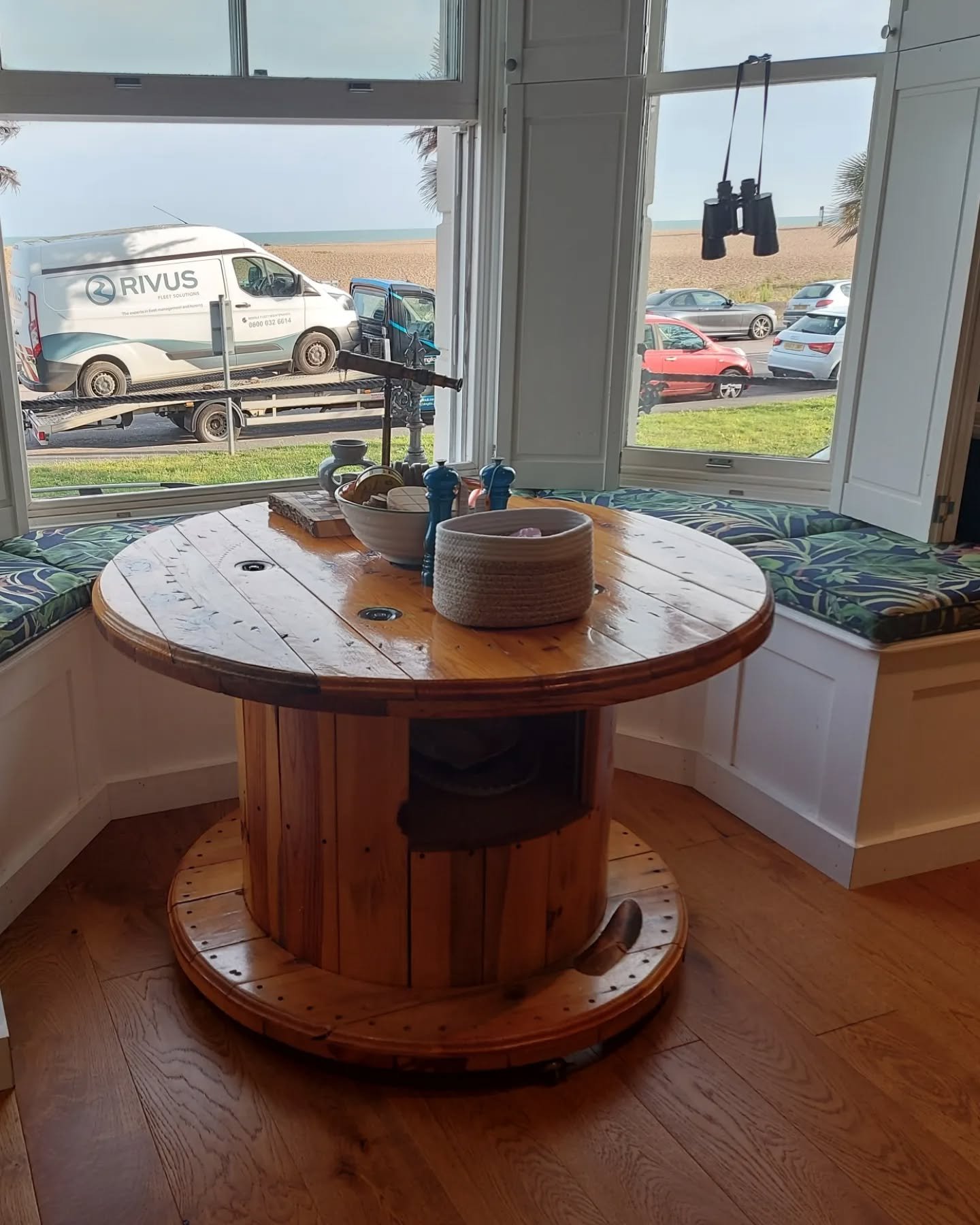 Box cushion seating for this stunning bay window dining area. This was a exciting and challenging project to make the seating seamlessly fit around the bay shape, mullions while allowing for each cushion to sit over the individual removable lids of t
