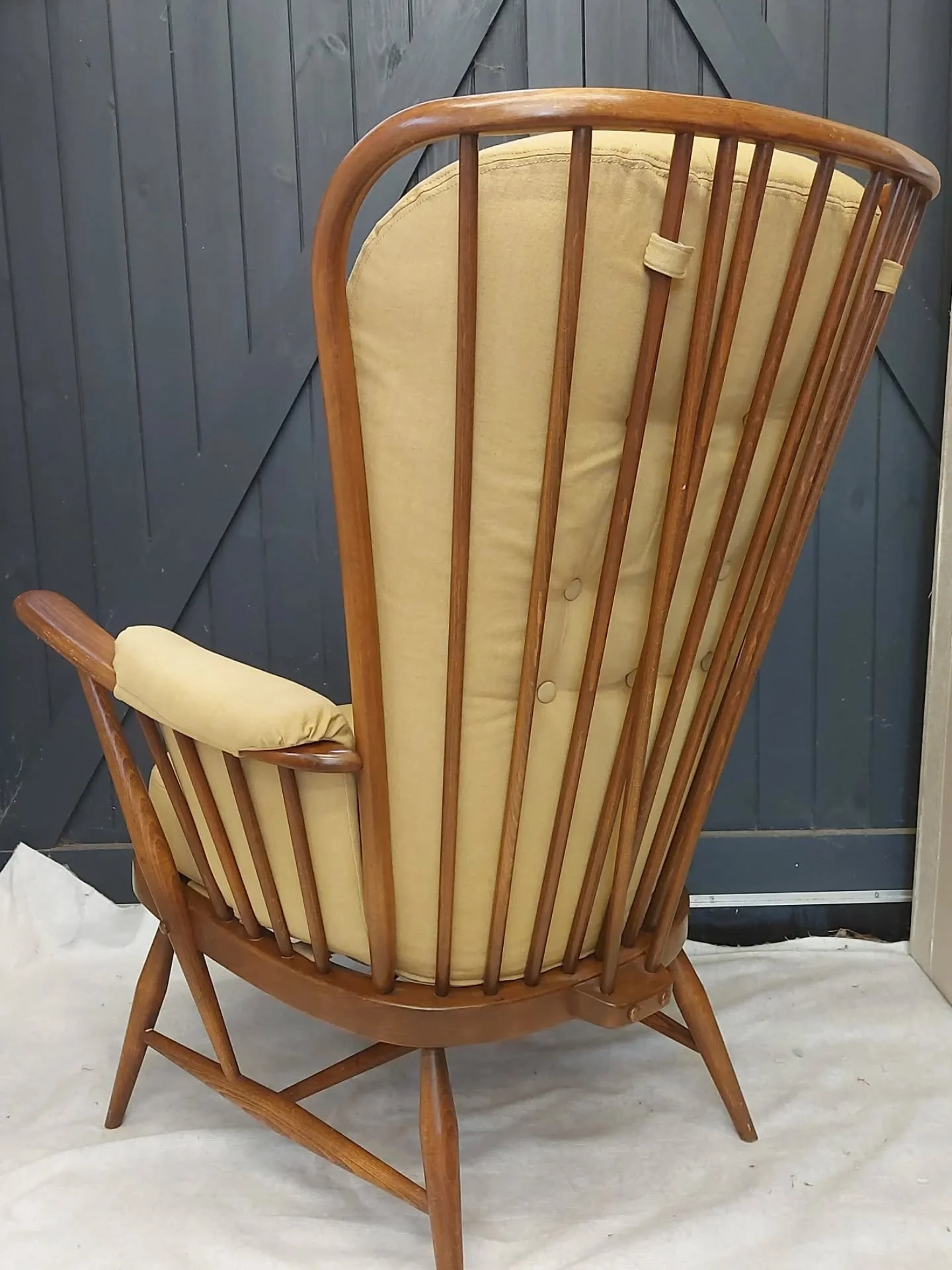 A classic Ercol chair, with it's simple spindle back iconic shape.
A client 'find', this chair was in great condition. The worn and dated fabric cover however needed replacing. 
My client chose something contemporary @merchantandmills Madeleine Japan