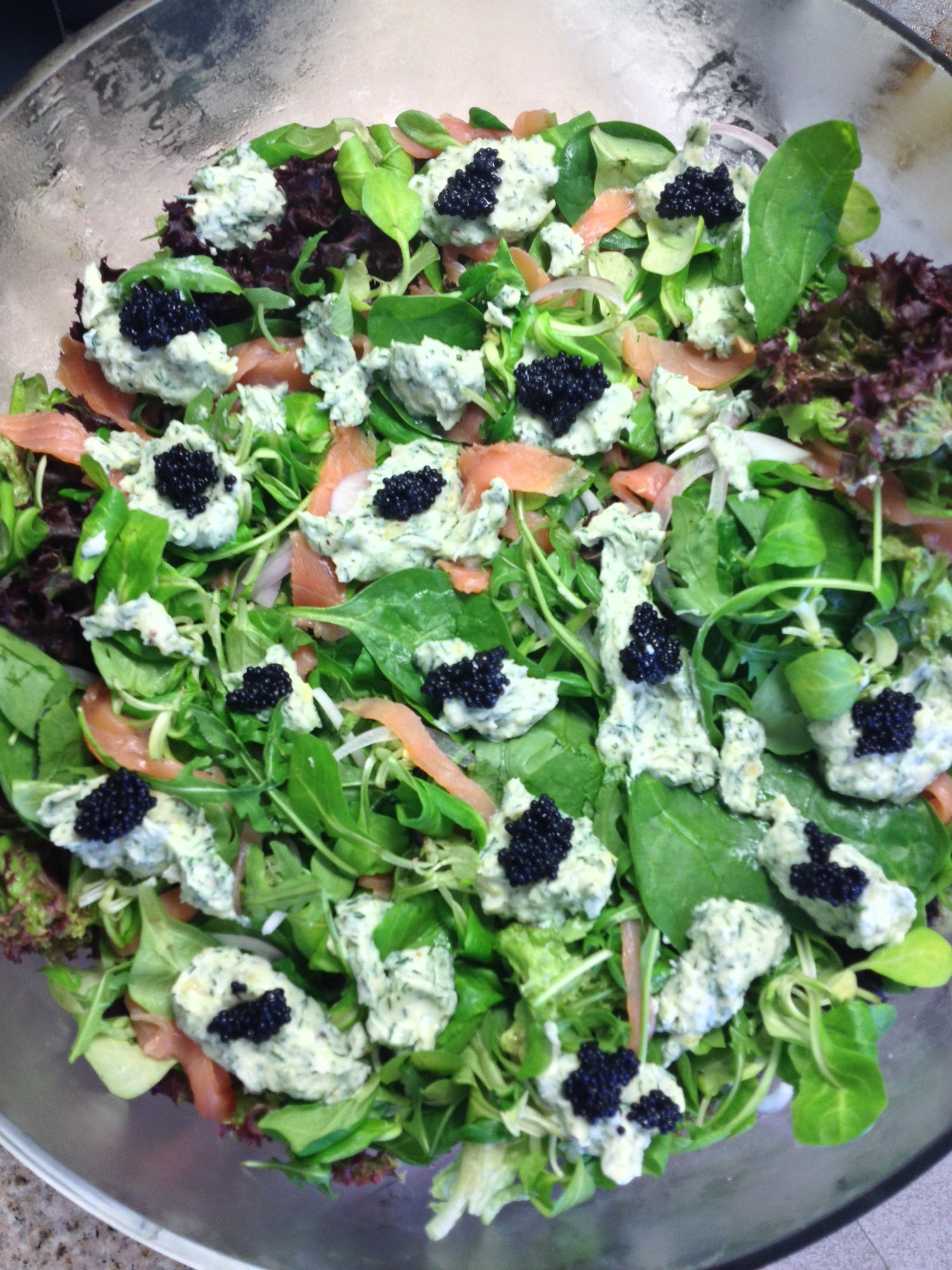 Mixed greens with herbed cheese and black caviar.