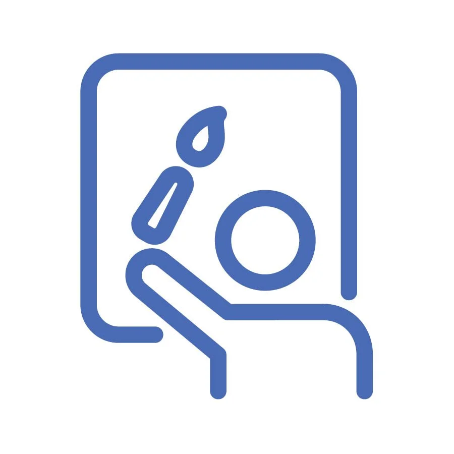 Facilitator designing structured conversation and learning experience at whiteboard.