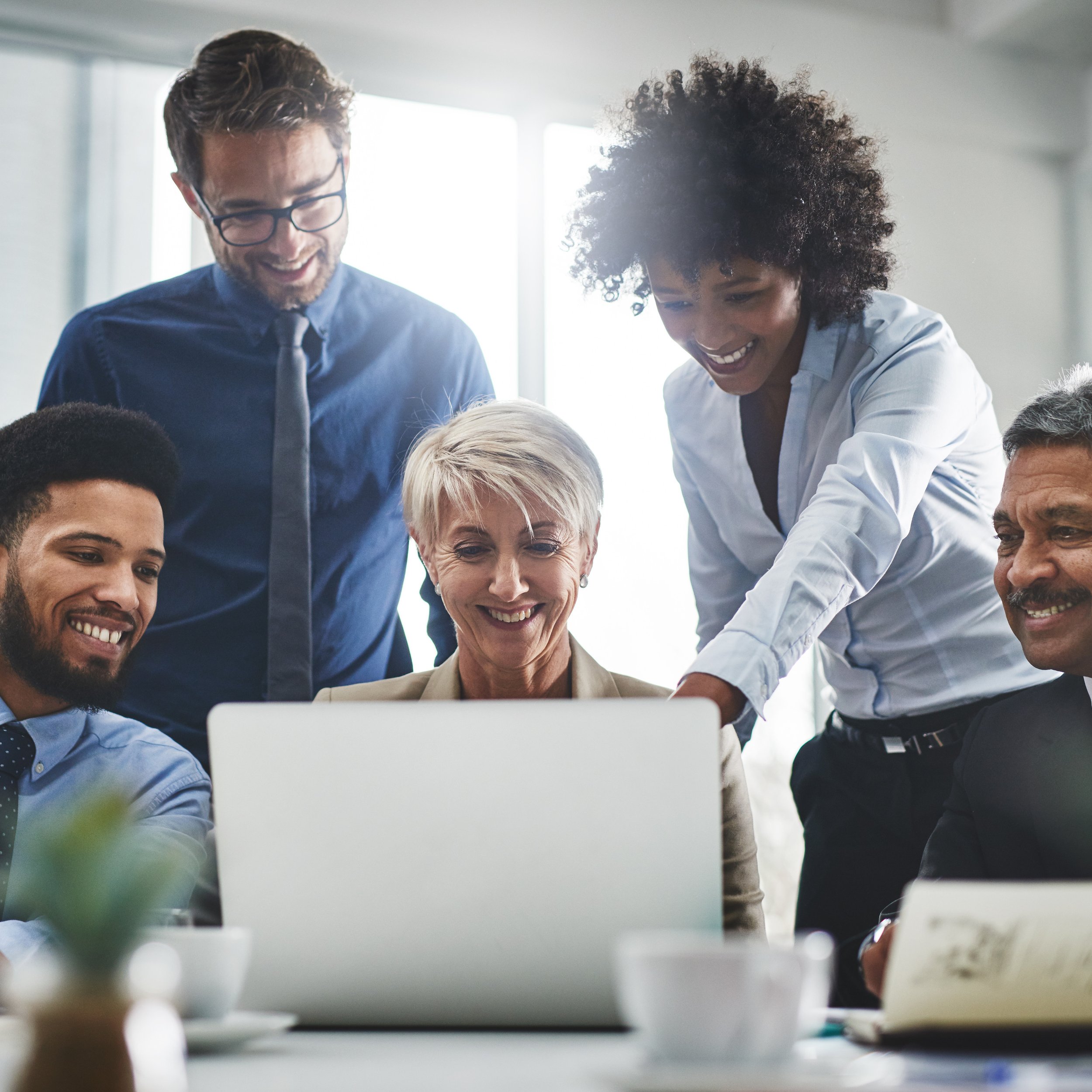 Team analyzing leadership and culture assessment data to inform better decisions.