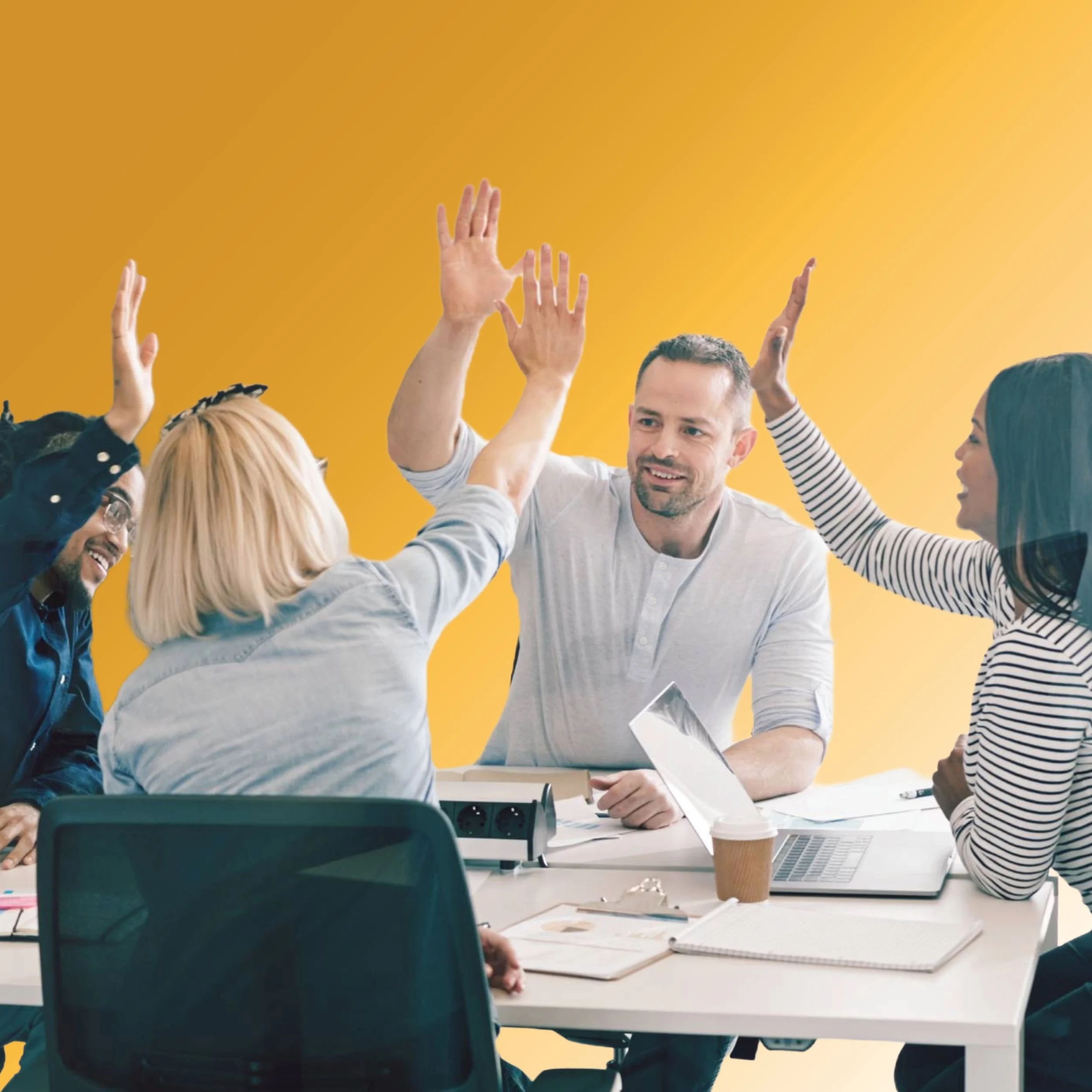 Team high-fiving during a working session focused on strategy execution and shared accountability.