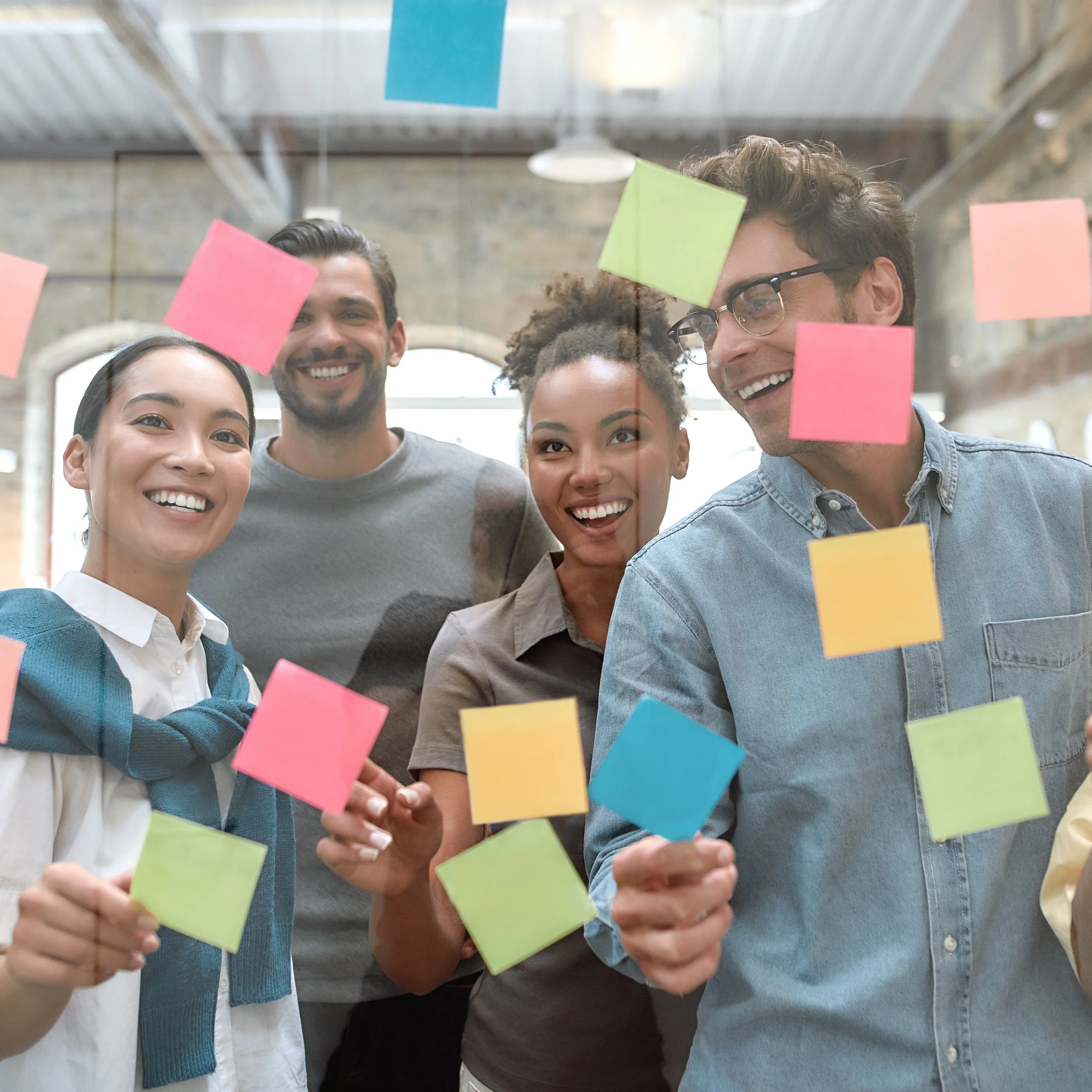 Team brainstorming with sticky notes to reinforce shared meaning and sustained change.