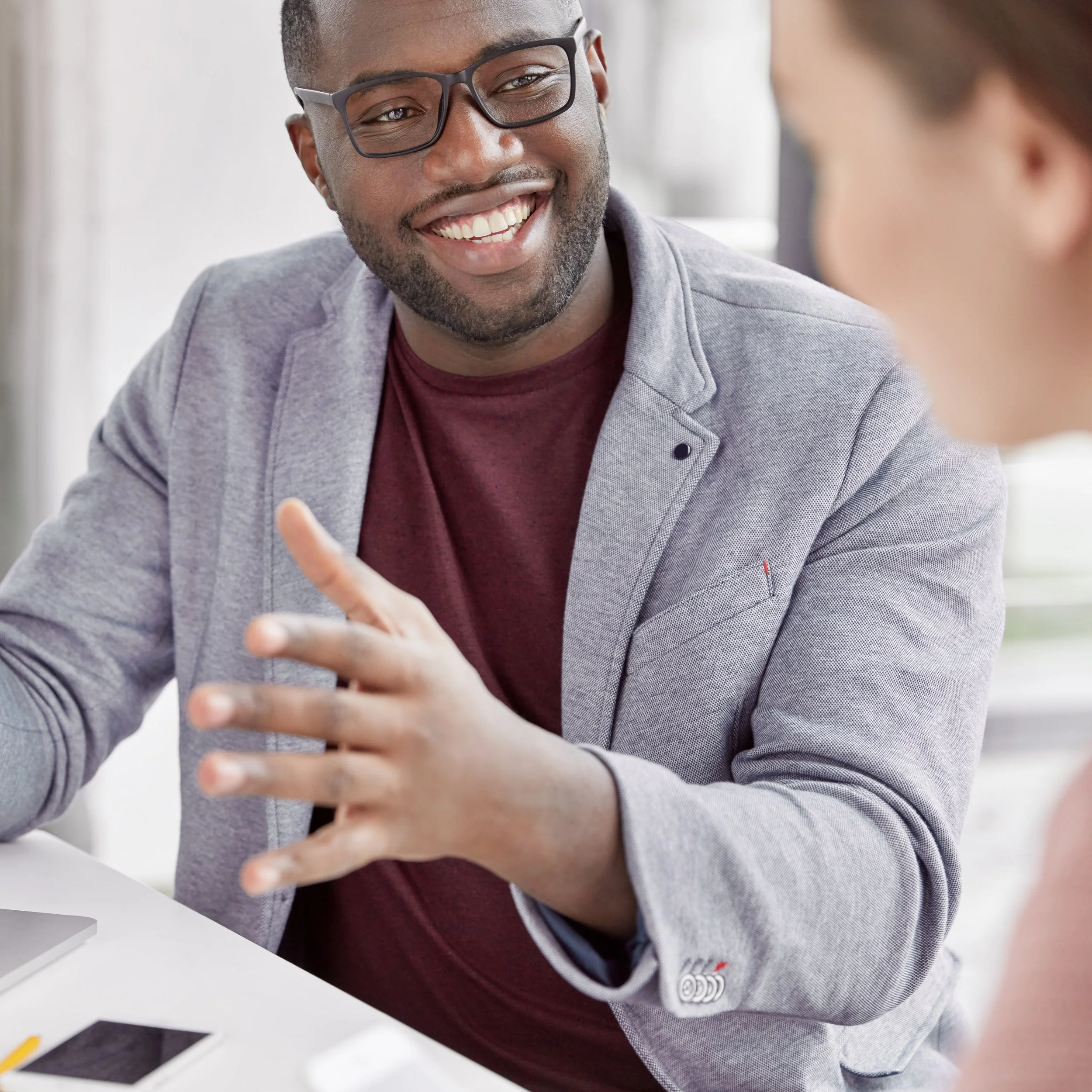 Leadership coaching conversation focused on strengthening team alignment and communication rhythms.