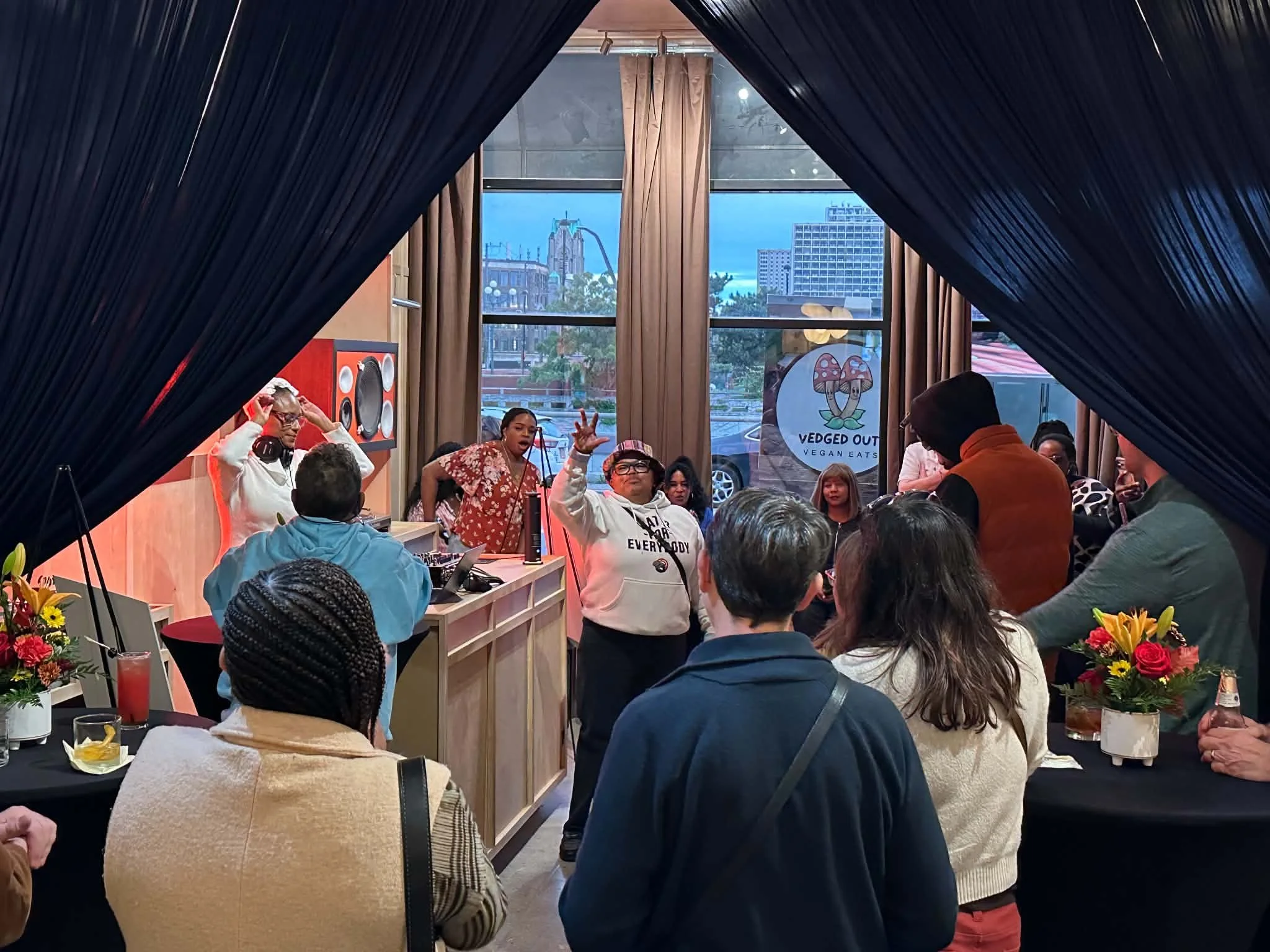 A group of people gathered in a small bar space