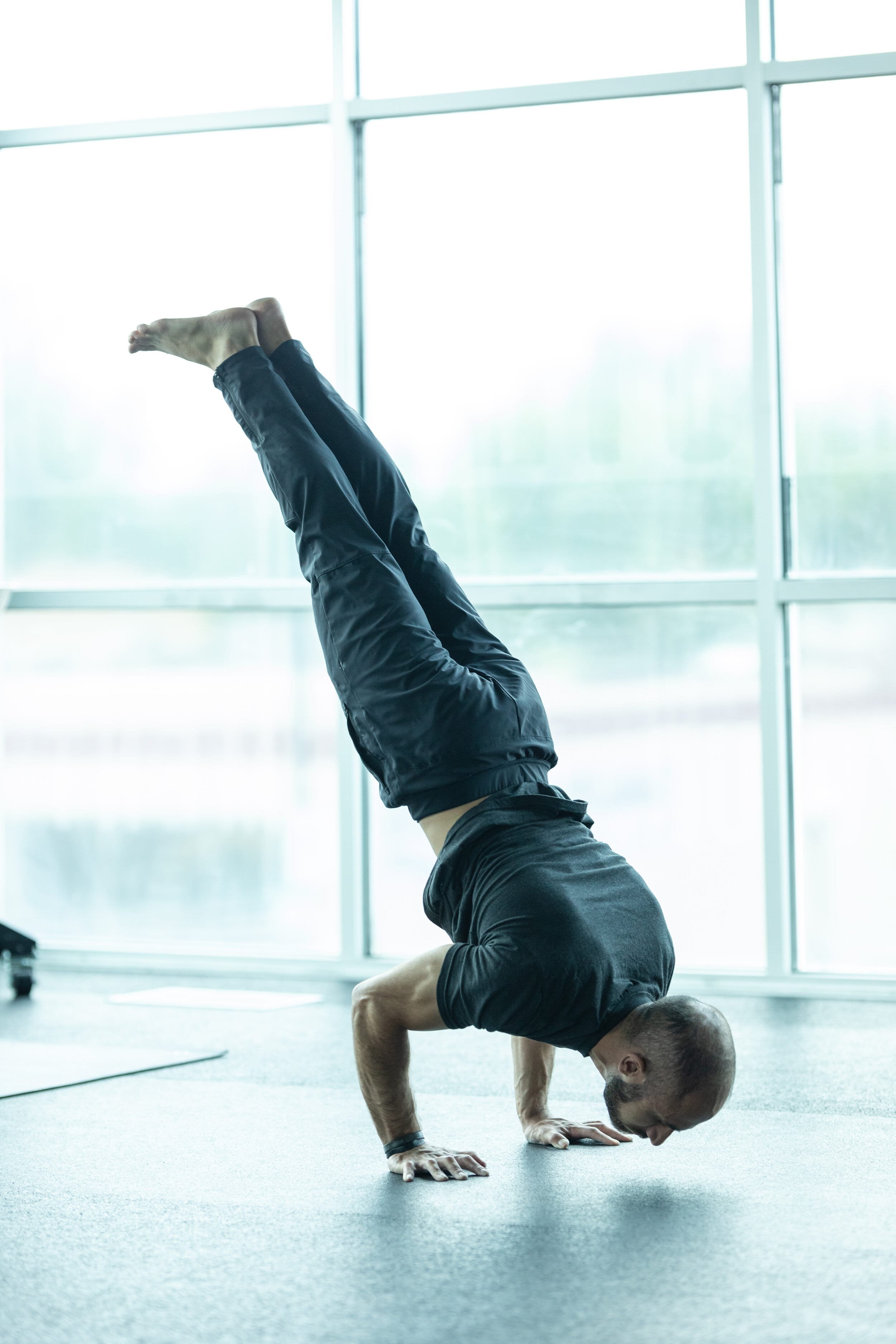 male personal trainer handstand push up