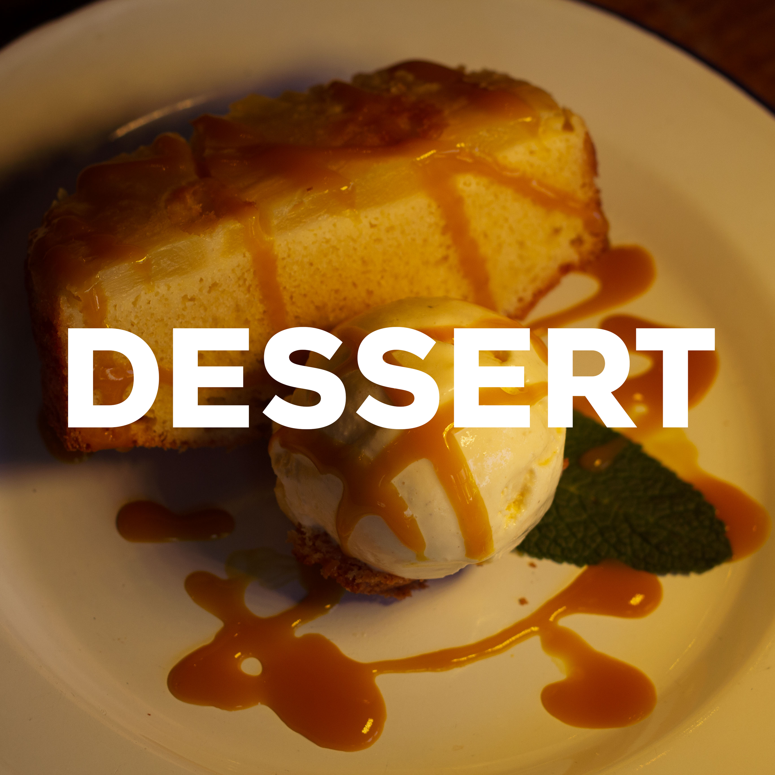 Desserts text over an image of a slice of cheesecake topped with caramel sauce, served on a white plate with caramel drizzle around it.