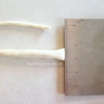 Smash one end of your breadstick rope with a dough cutter