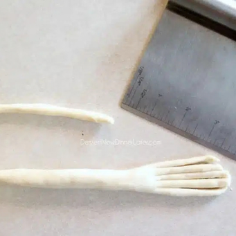 Cut bristles with the dough cutter or a knife