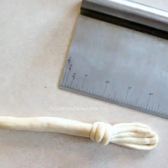 Take the small rope &amp; wrap it directly above the bristles
