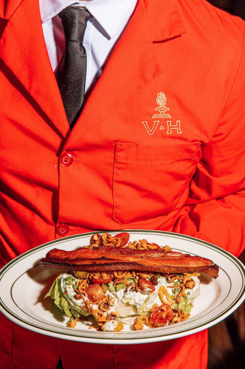 Vanhorns Waiter holding dish.png