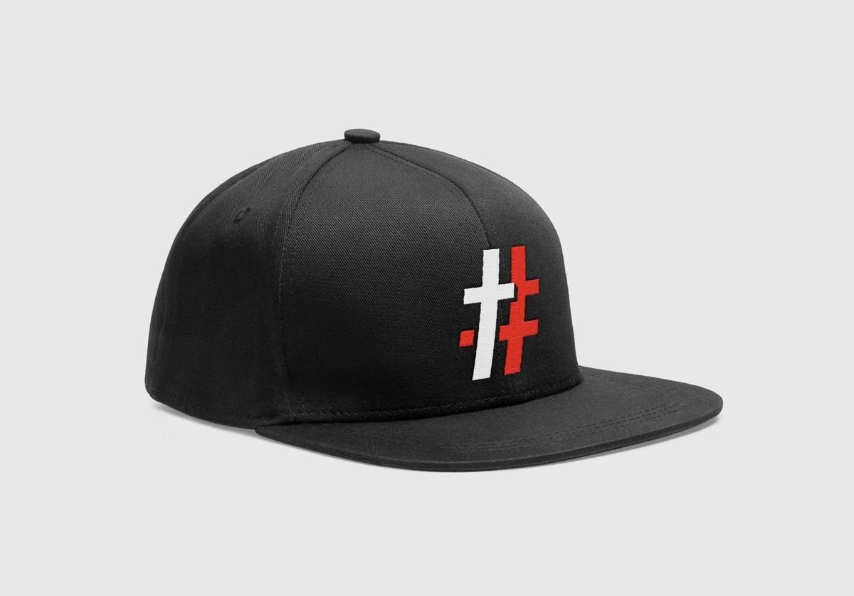 Black snapback with red and white # cross embroidery