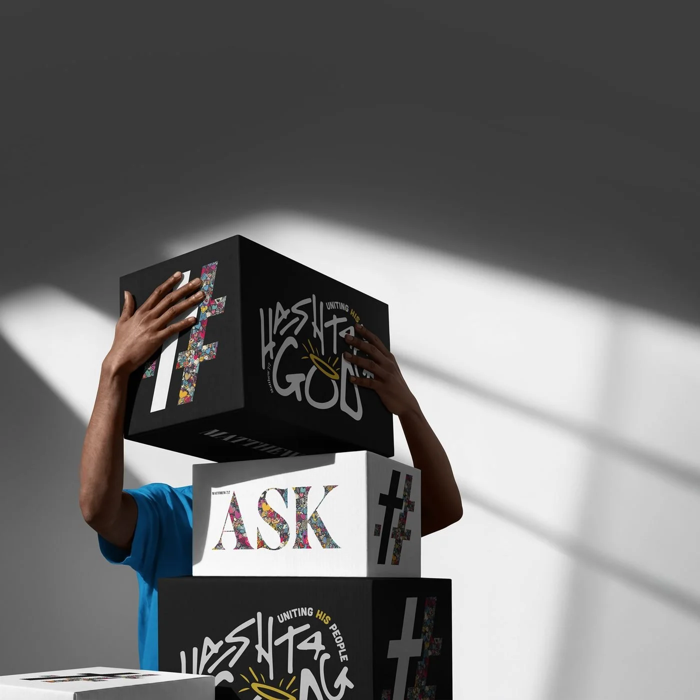 Stacked Hashtag God boxes printed with ASK and Uniting His People