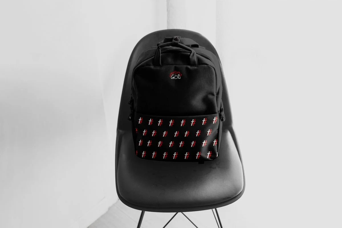 Black backpack with a # cross pattern pocket