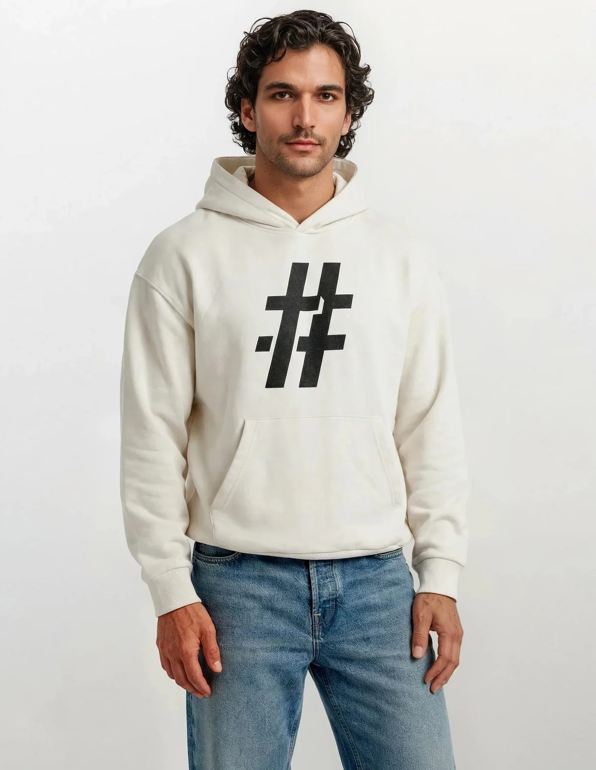 Man in a cream hoodie with a black # cross mark