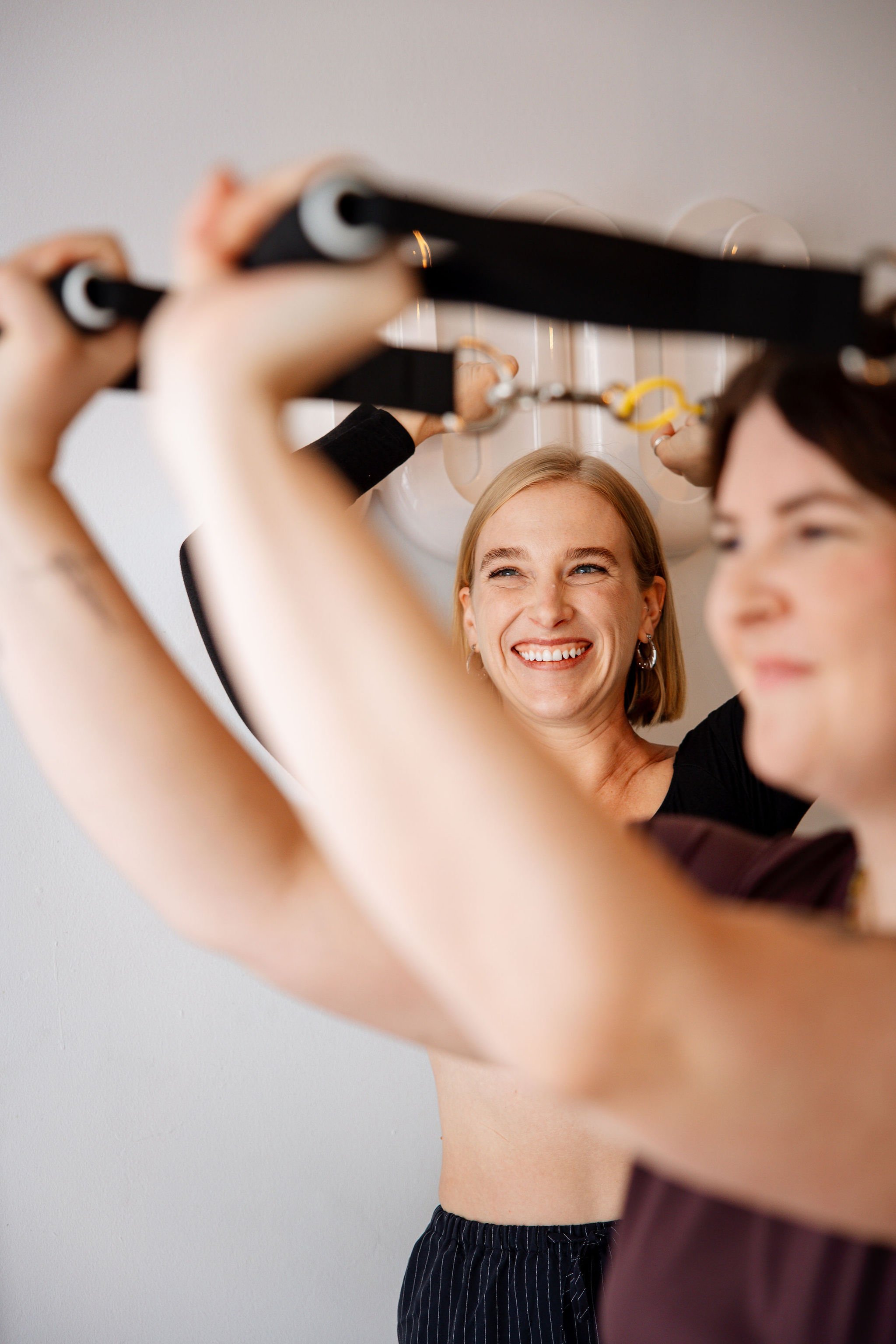 Susan Dowd providing individual guidance to a client during a semi-private Pilates session at Rosy Movement, Collingwood