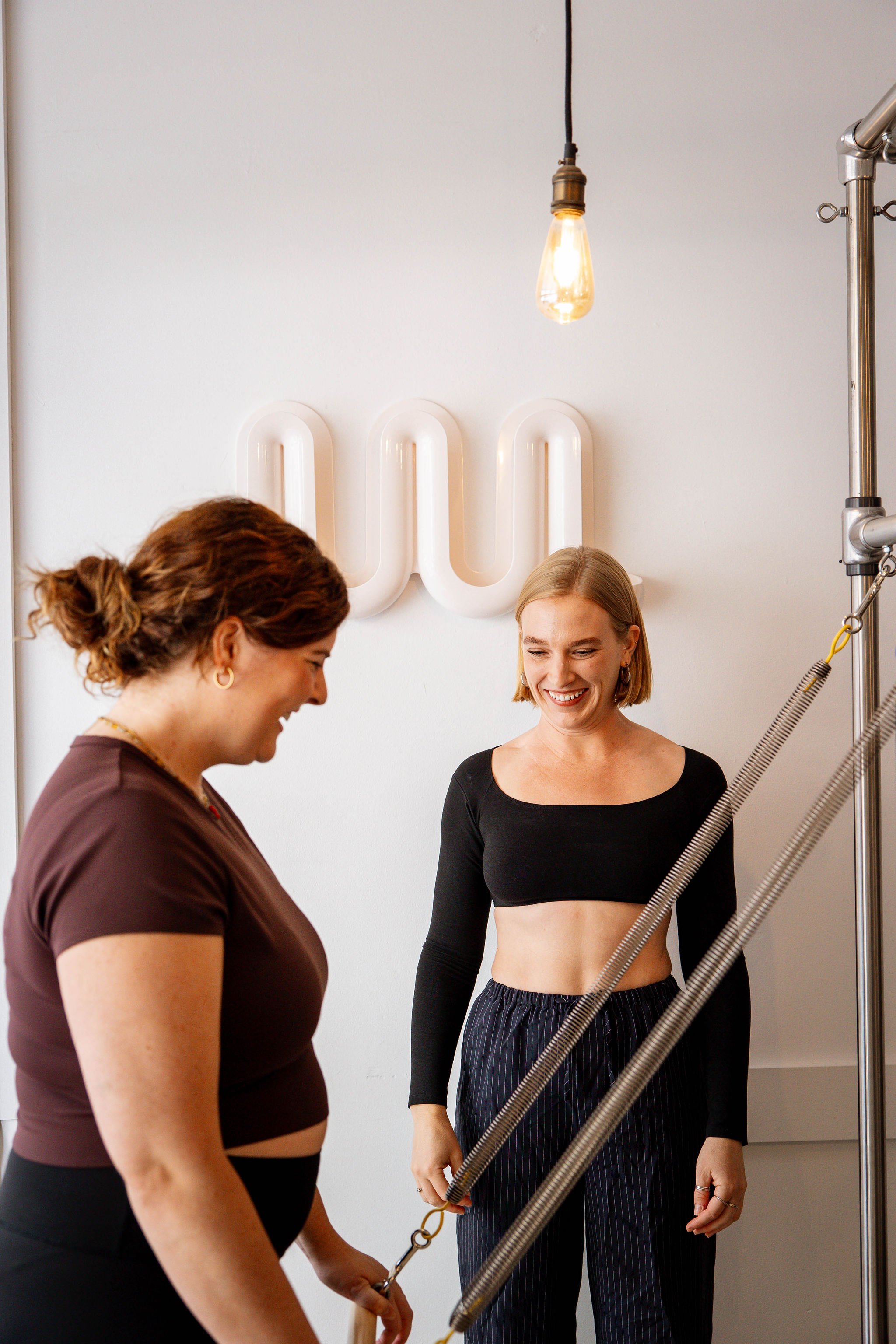 Susan Dowd working with a client during a size-inclusive private Pilates session at Rosy Movement, Collingwood