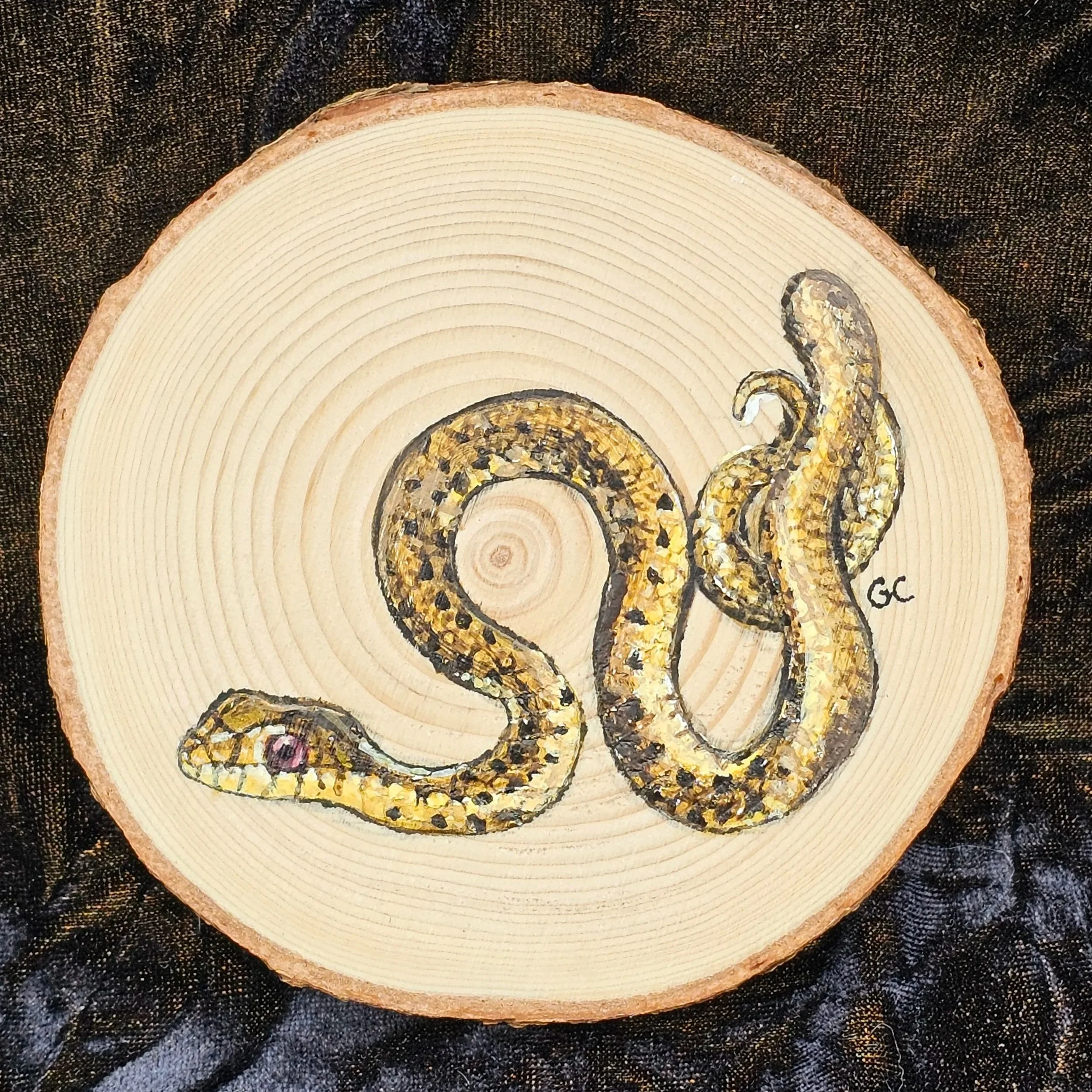 Snaklet, acrylic on wood cookie, 2025