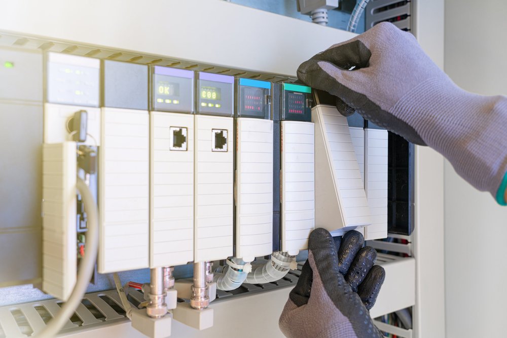 Technician working on inverter control modules