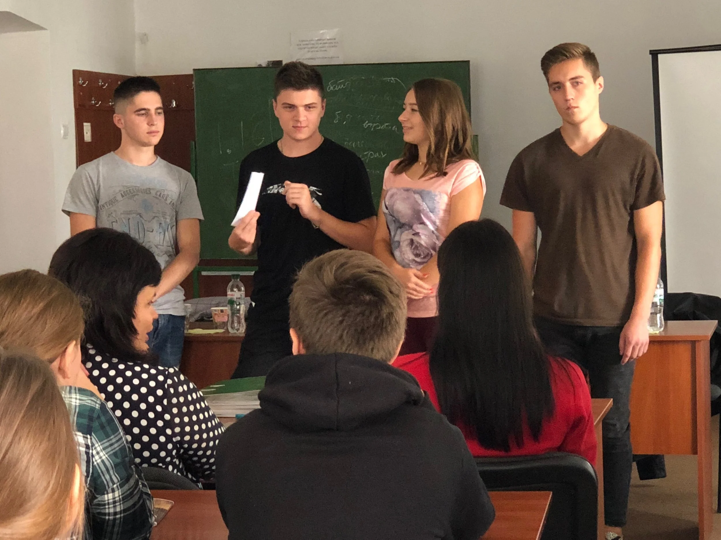 Children working on art projects in classroom