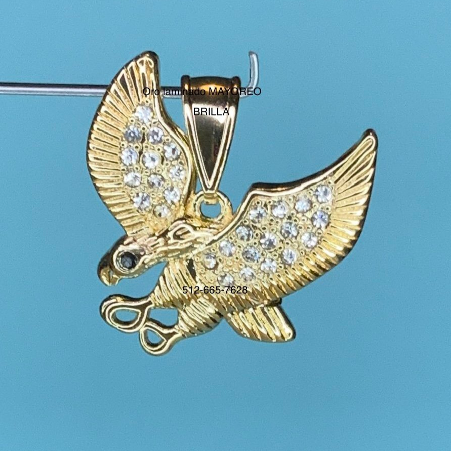 Dije paloma oro laminado con piedras. Gold plated dove pendant with stones.