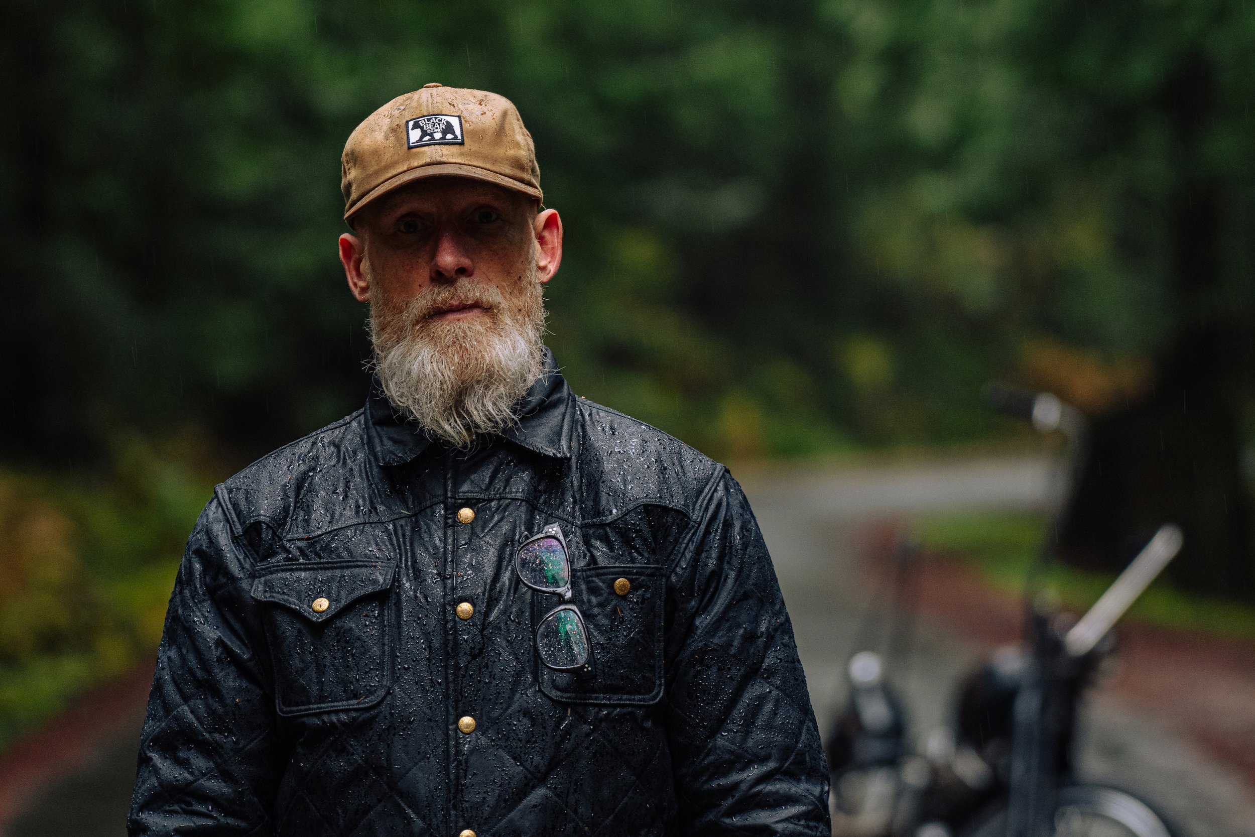 Black Bear Brand BLACK Wax Canvas Embracing the elements in style! 🌲🏍️ This rugged adventurer conquers the Pacific Northwest rainforest on his sleek motorcycle