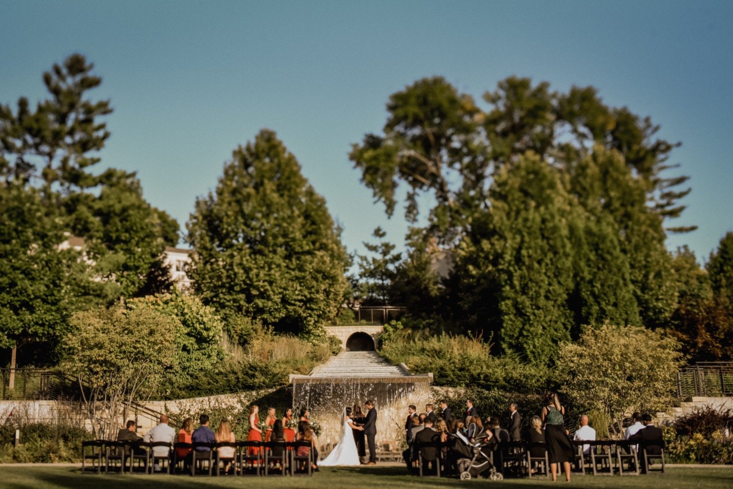 Botanical-garden-in-Des-Moines-iowa-outdoor-waterfall-wedding-ceremony-at-sunset.jpg.jpg
