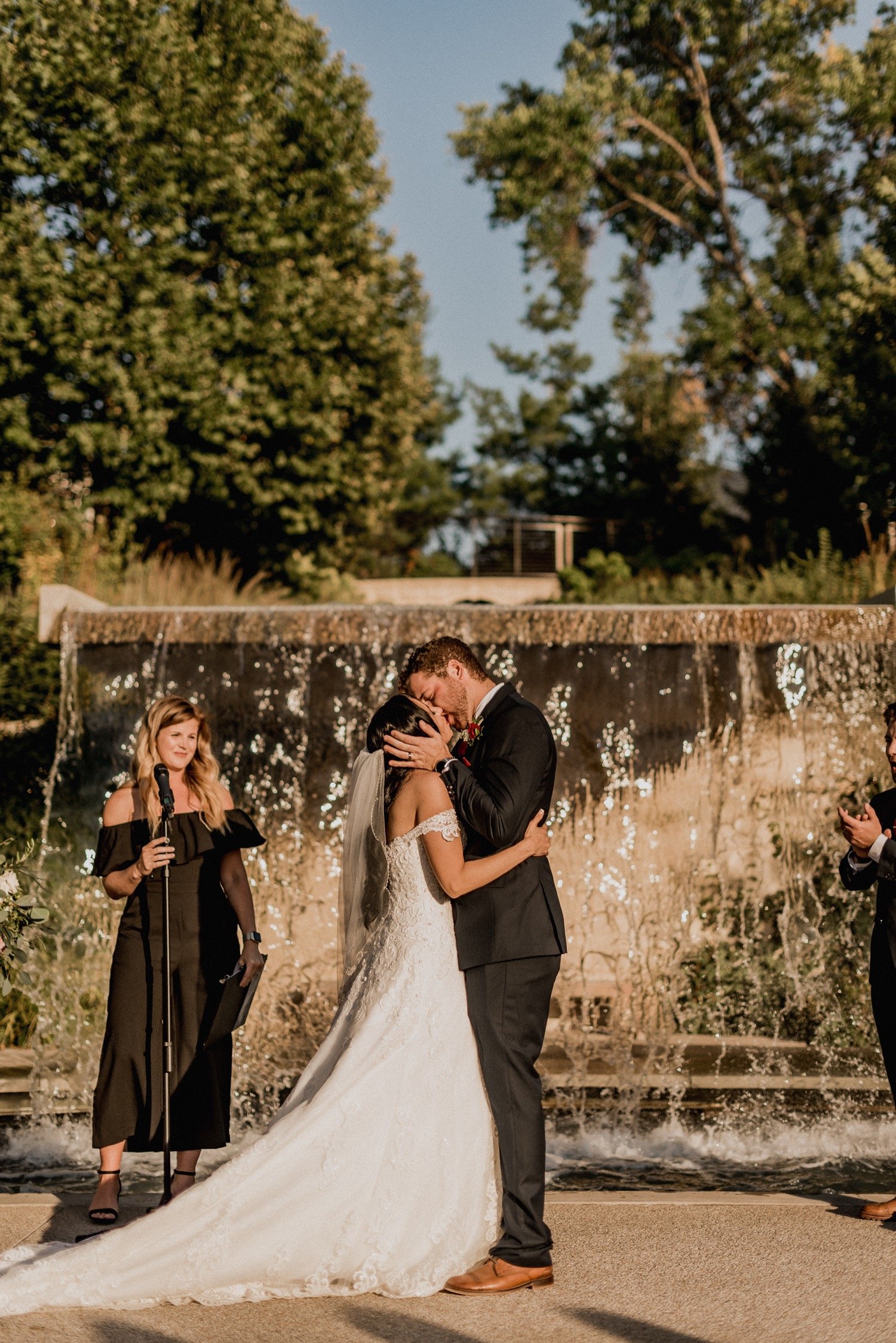 First-kiss-outdoor-waterfall-wedding-ceremony-at-Des-Moines-iowa-botanical-garden.jpg.jpg