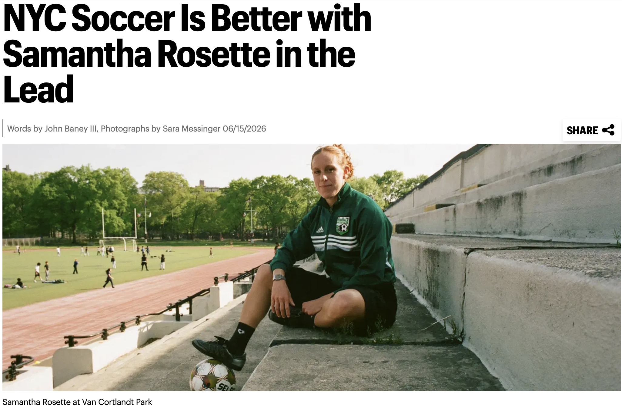 Samantha Rosette sitting on concrete steps at Van Cortlandt Park with a soccer ball at her feet, wearing a green athletic jacket, surrounded by a sports field with children playing soccer in the background, trees, and a goalpost.