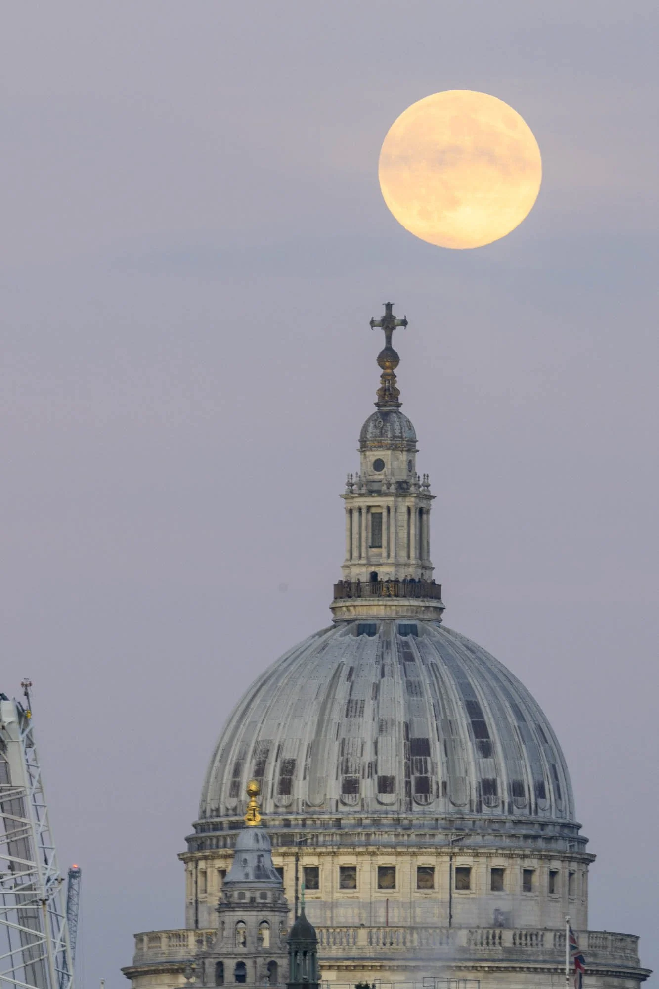 Beaver Supermoon passing behind the dome of St Paul's Cathedral