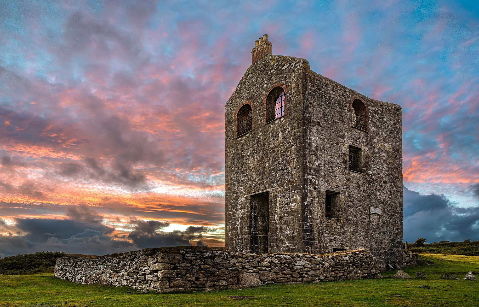 Old mine ruins, South Phoenix Mine, as the sun set in between heavy rain showers near Minions on Bodmin Moor