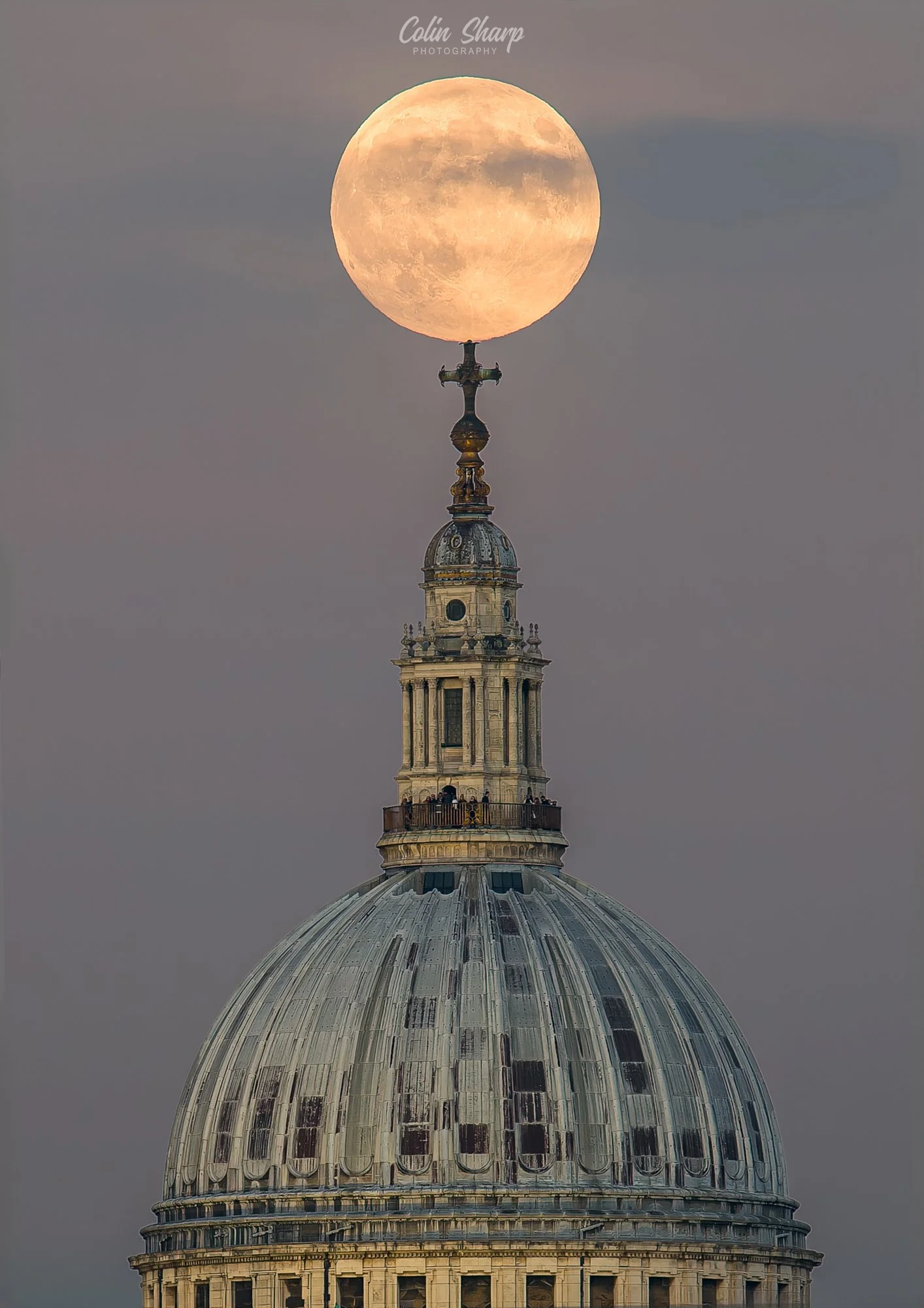 St Paul's Cathedral London with the Beaver Supermoon rising above the top finial of the dome.