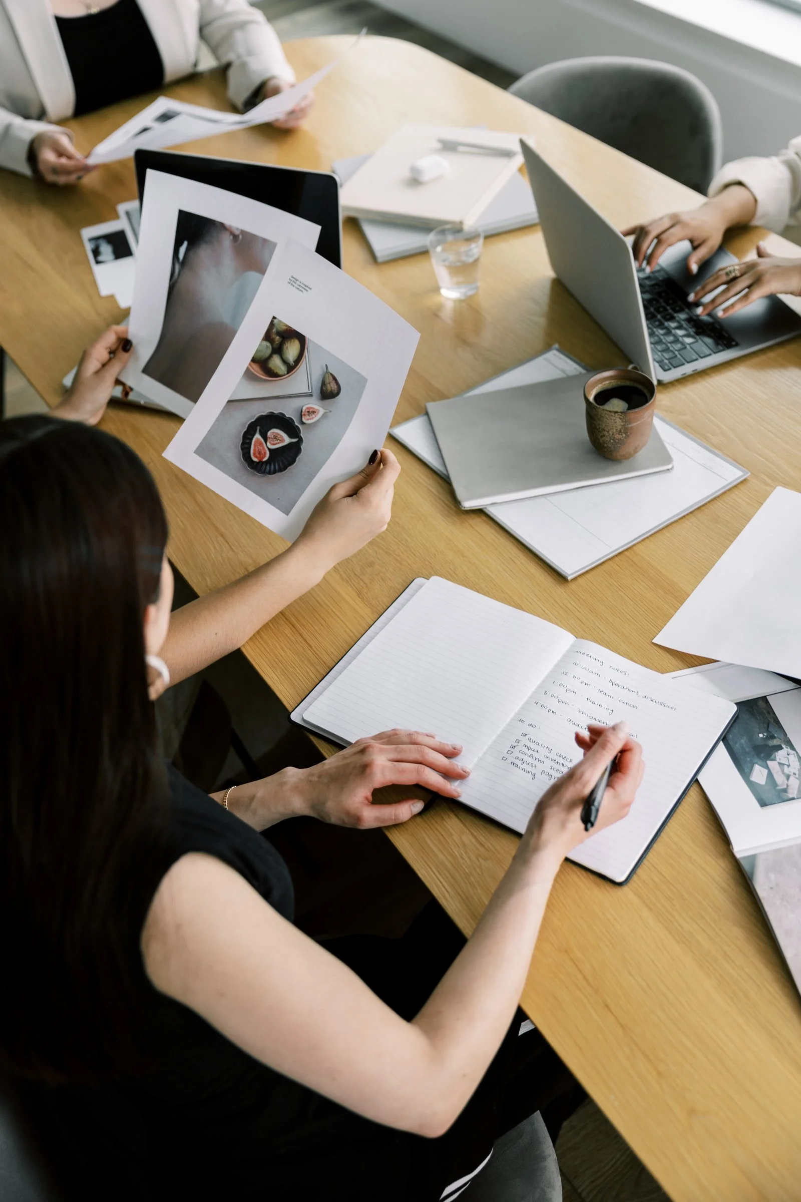 Women collaborating together in a group meeting