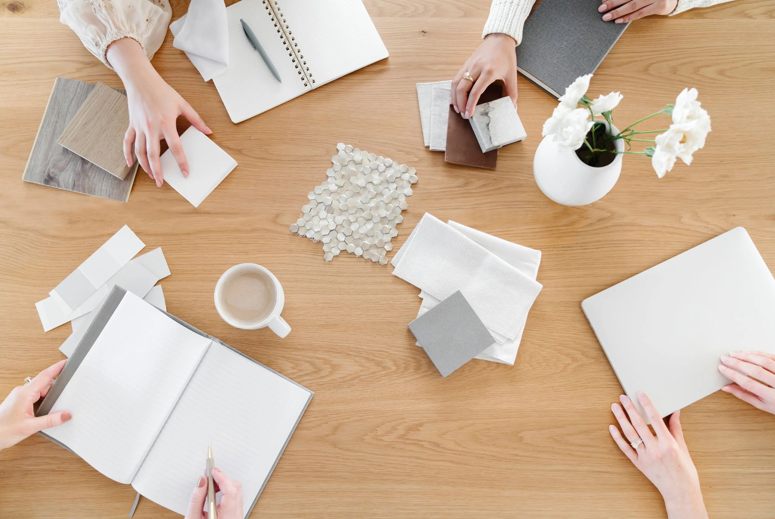 Women collaborating on design materials